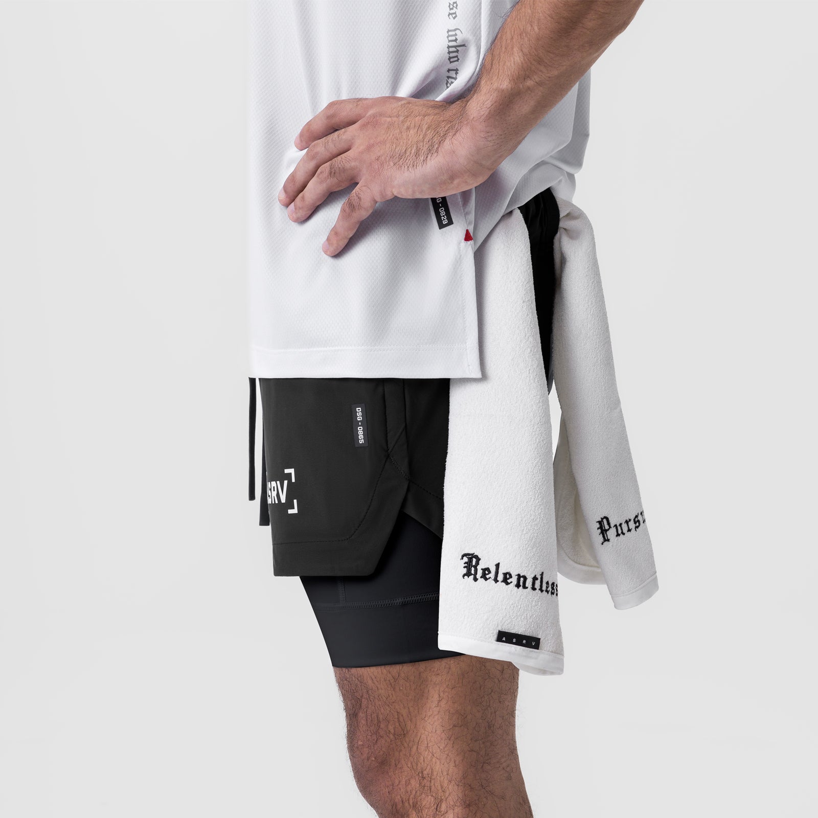 Tetra-Lite 5" Liner Short in black, worn with white tee and towel, side view