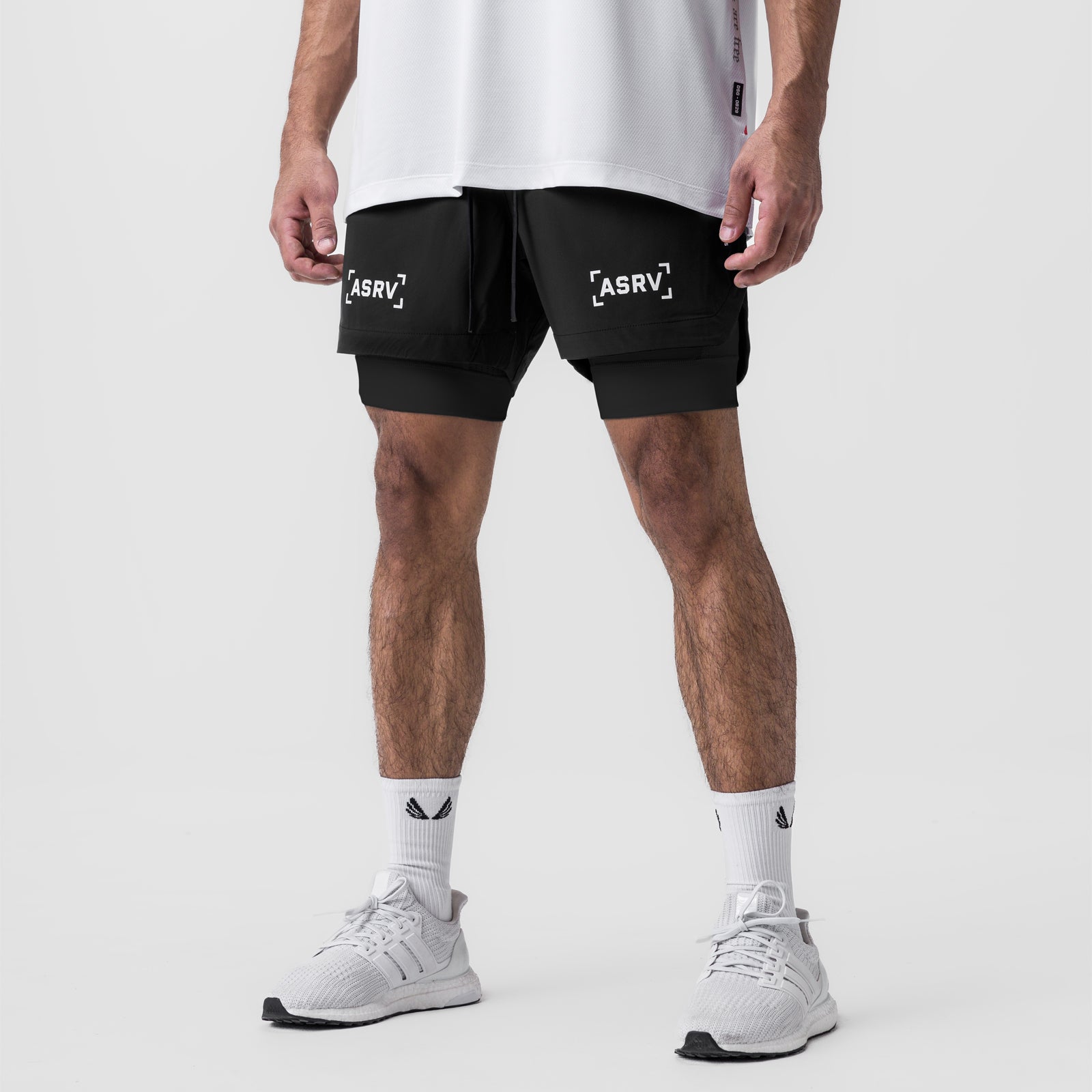 Tetra-Lite 5" Liner Short in black with ASRV branding, worn by model with white socks and sneakers