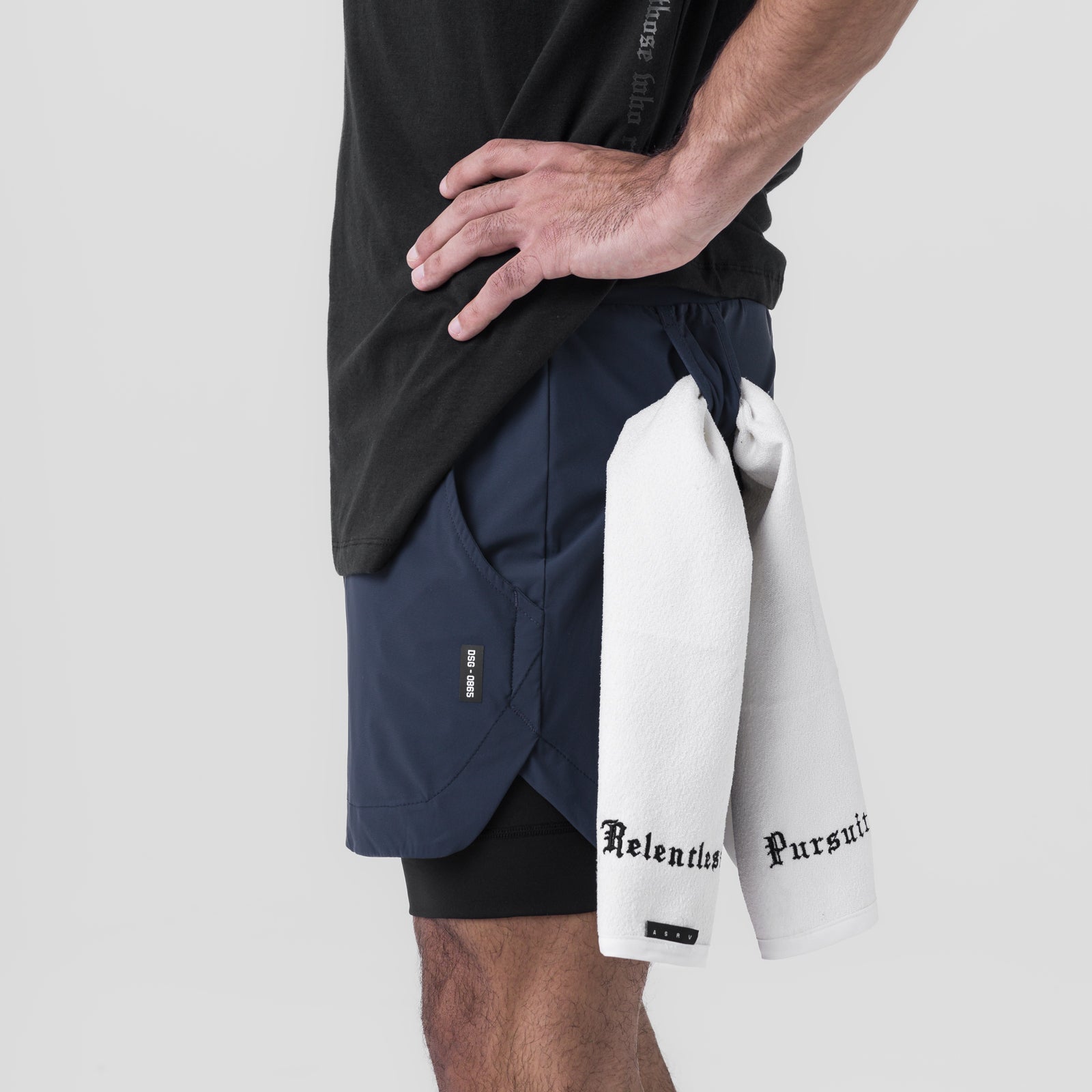 Tetra-Lite 5" Liner Short in Navy and Black, worn with white towel, side view