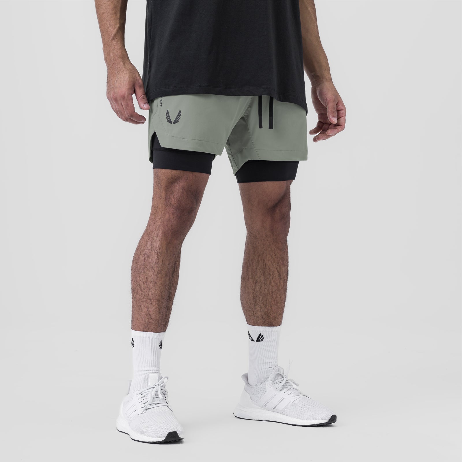 Tetra-Lite 5" Liner Short in Sage and Black, worn with white socks and sneakers