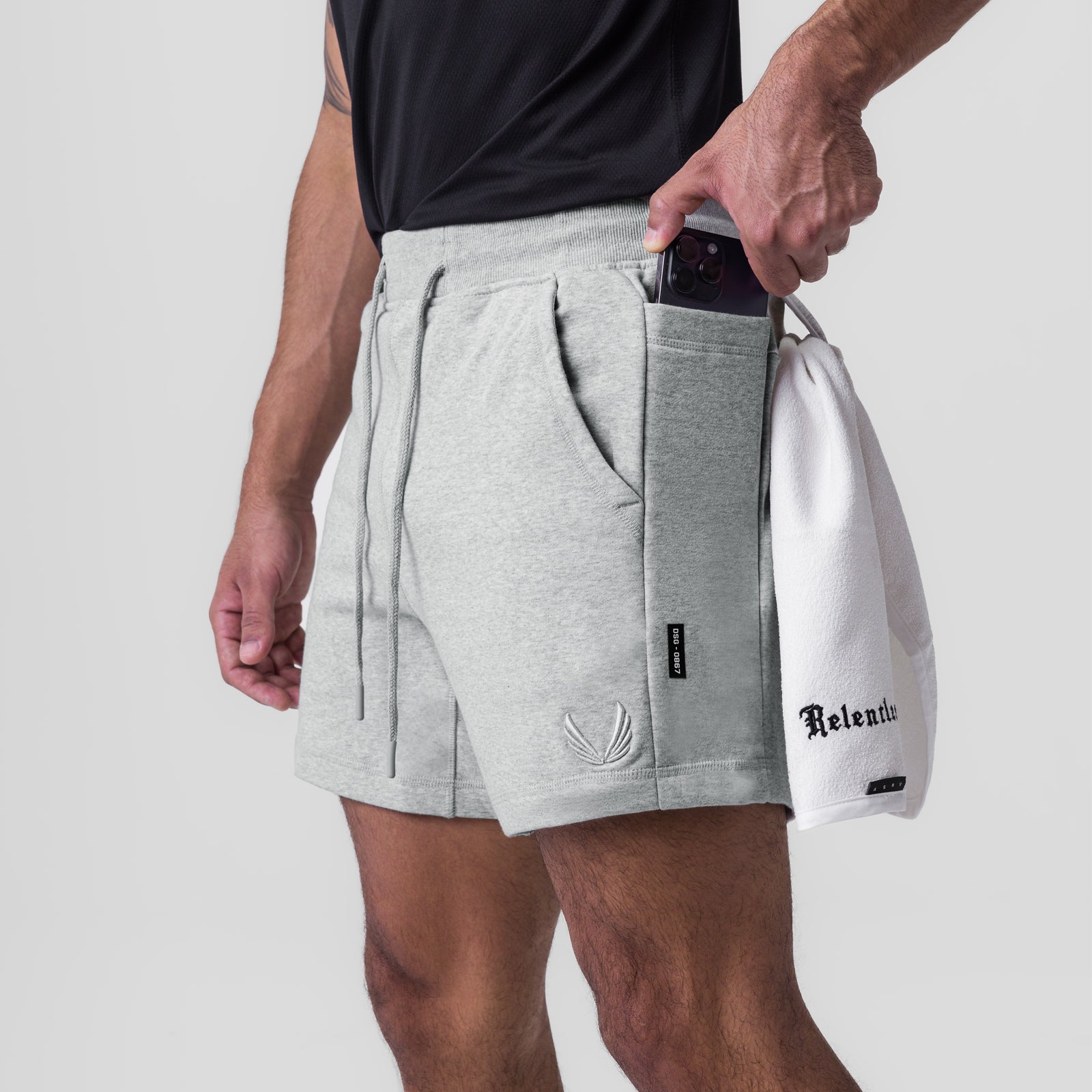 Tech-Terry Sidelock Sweat Short in Heather Grey, worn by model with phone in pocket