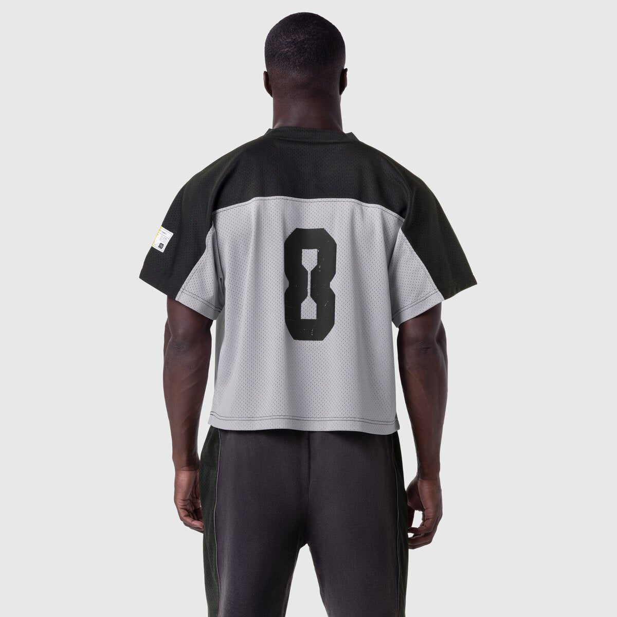 Ion-Mesh™ Crop Jersey in slate grey and black, back view on model