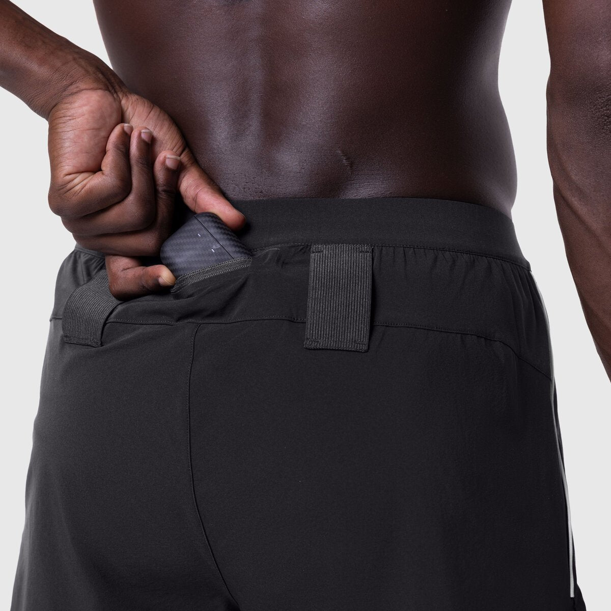 Aerotex 3" Distance Short in black, worn by model showing back waistband detail