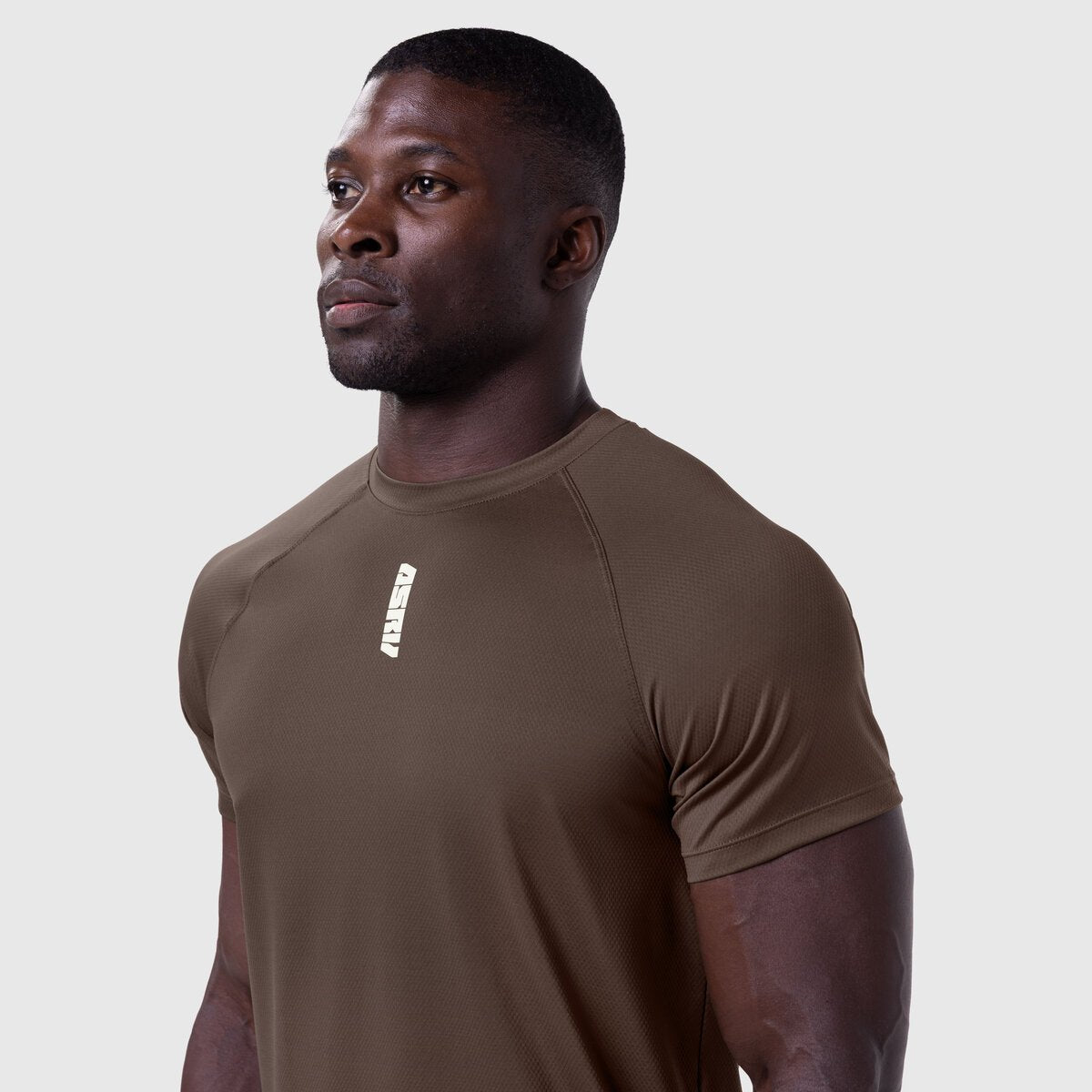 AeroSilver Established Tee in dark earth, worn by model in profile view