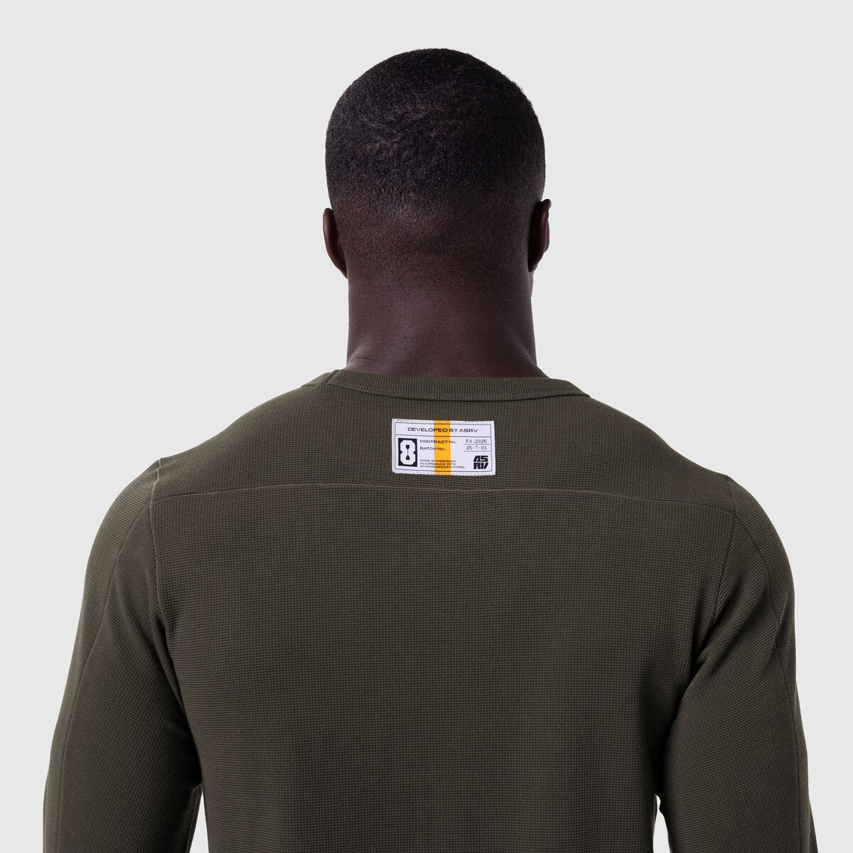 Olive waffle knit longsleeve worn by model, back view