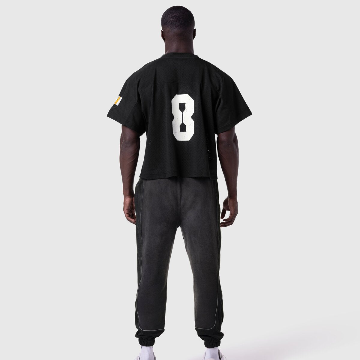 Ion-Mesh™ Crop Jersey in black with white number 8 on back, worn by model, rear view