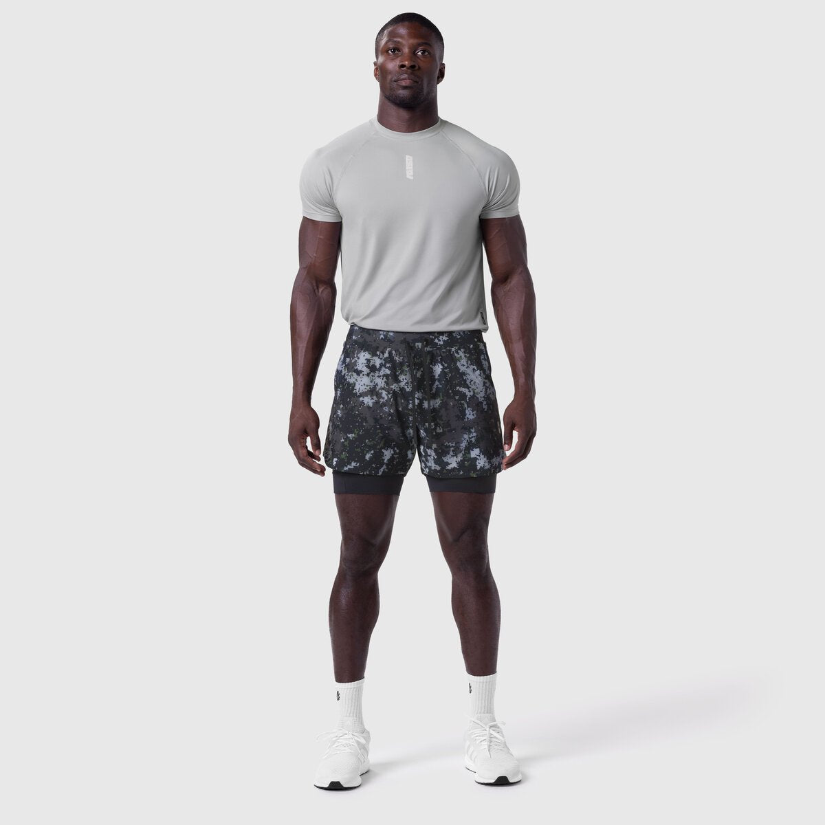 Tetra-Lite Liner Short in pixel camo, worn by model standing facing camera
