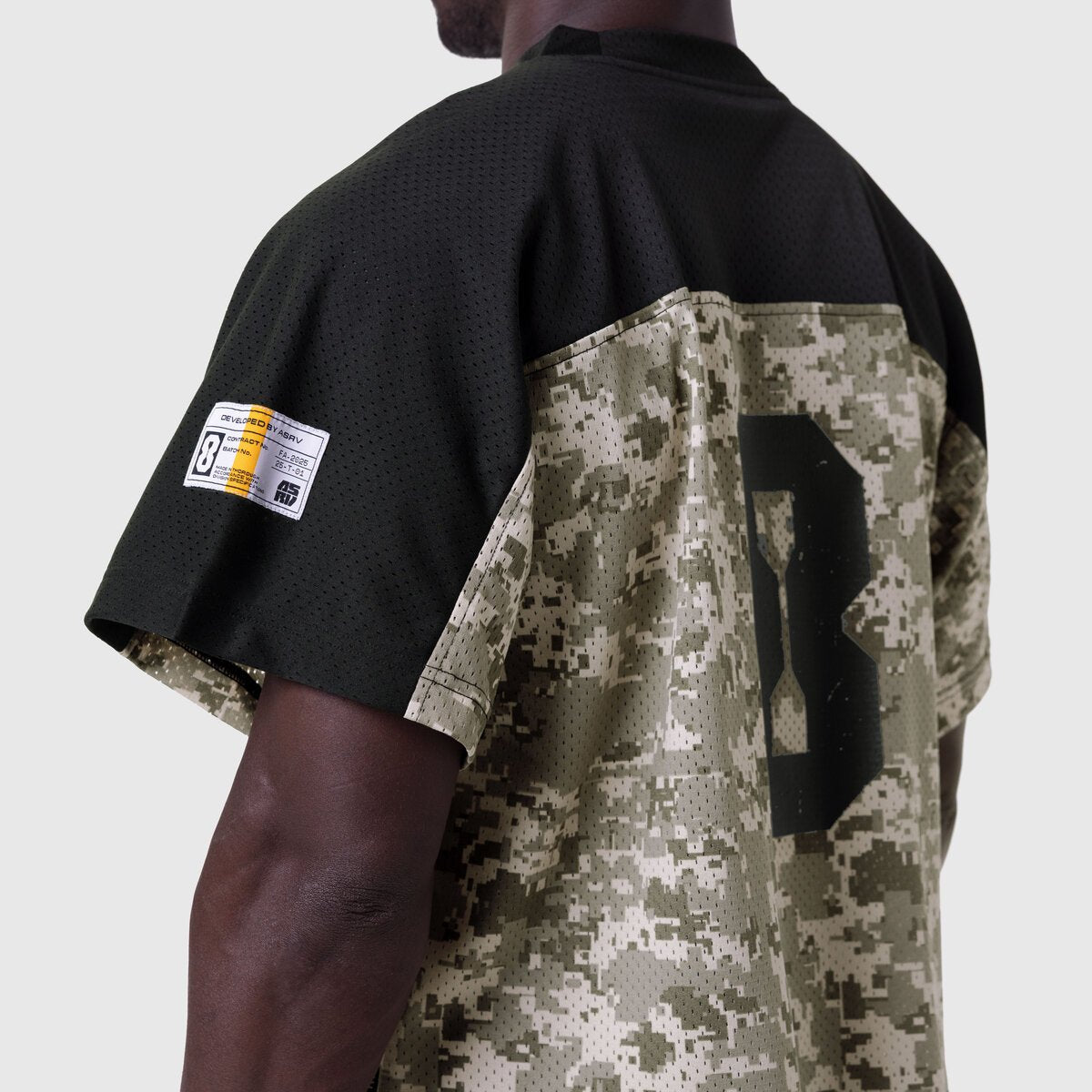 Ion-Mesh™ Crop Jersey in black and digital camo, worn by model showing back view