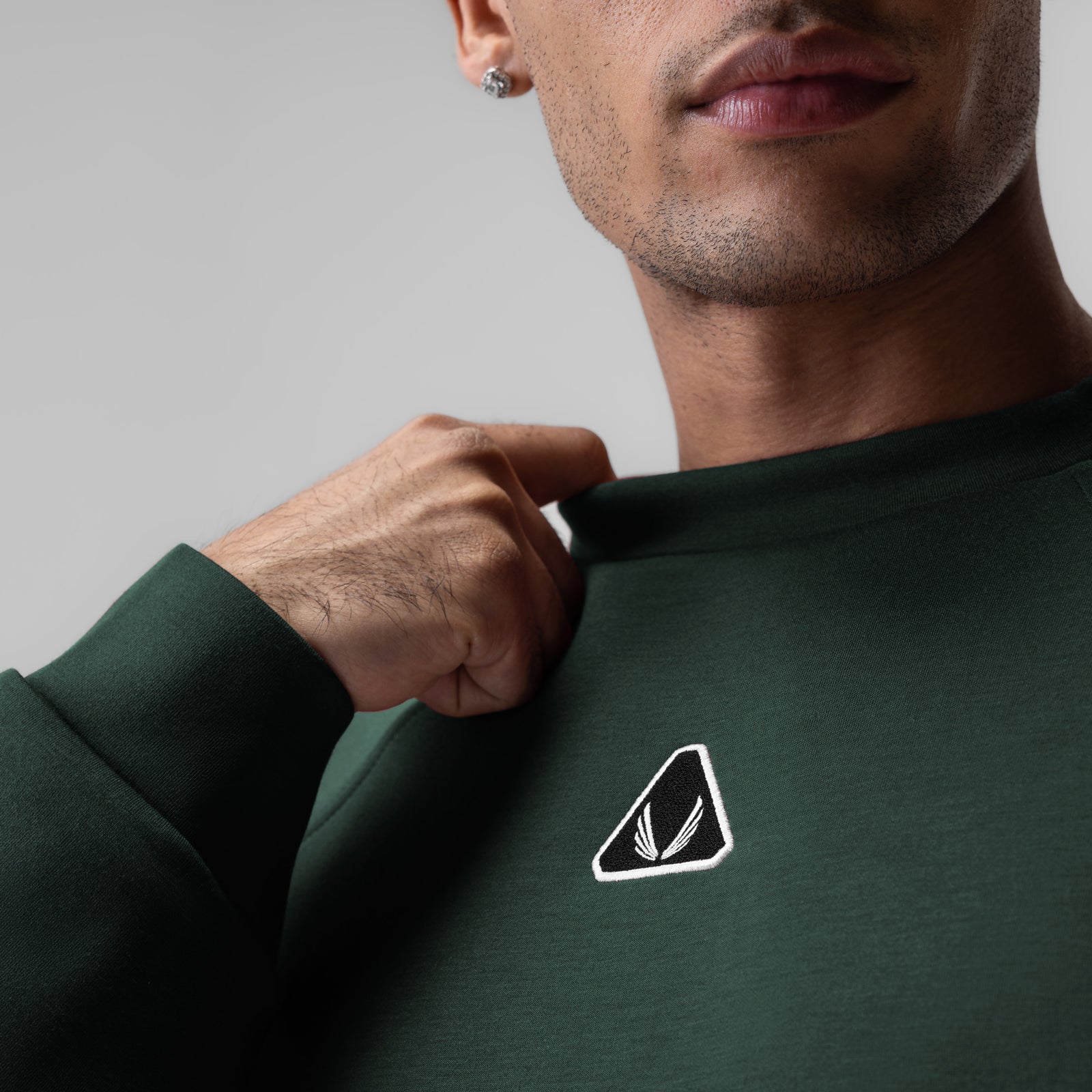 Dri-Core™ Oversized Crewneck in forest green, worn by model showing chest logo detail