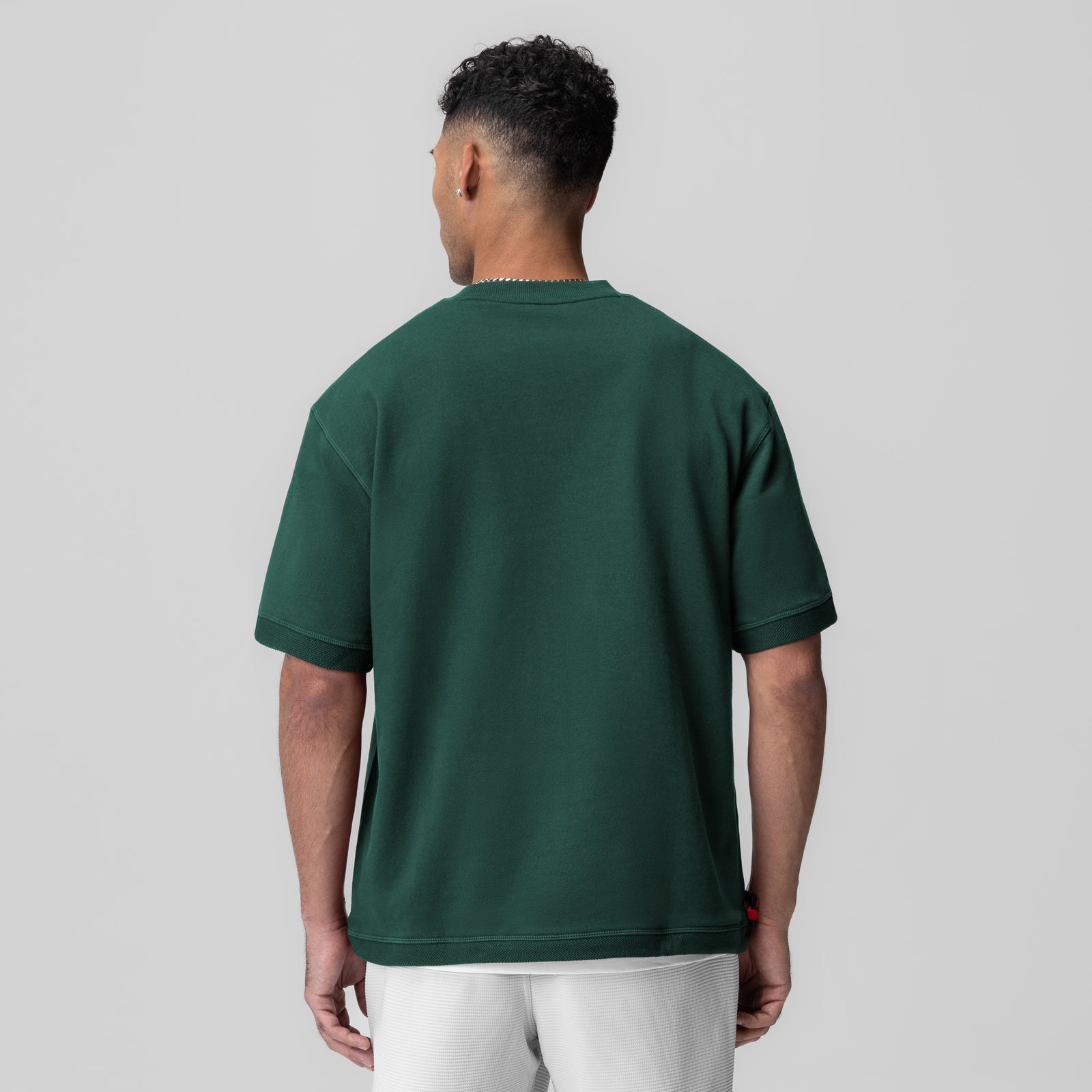 Herringbone Terry Oversized Cinch Tee in forest green, back view on model