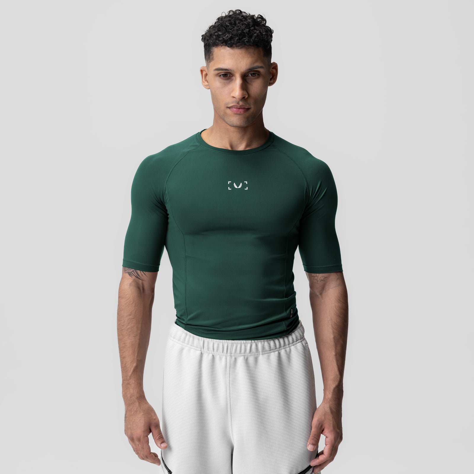 WarpFlexx-Lite® half-sleeve baselayer in forest green, worn by model, front view