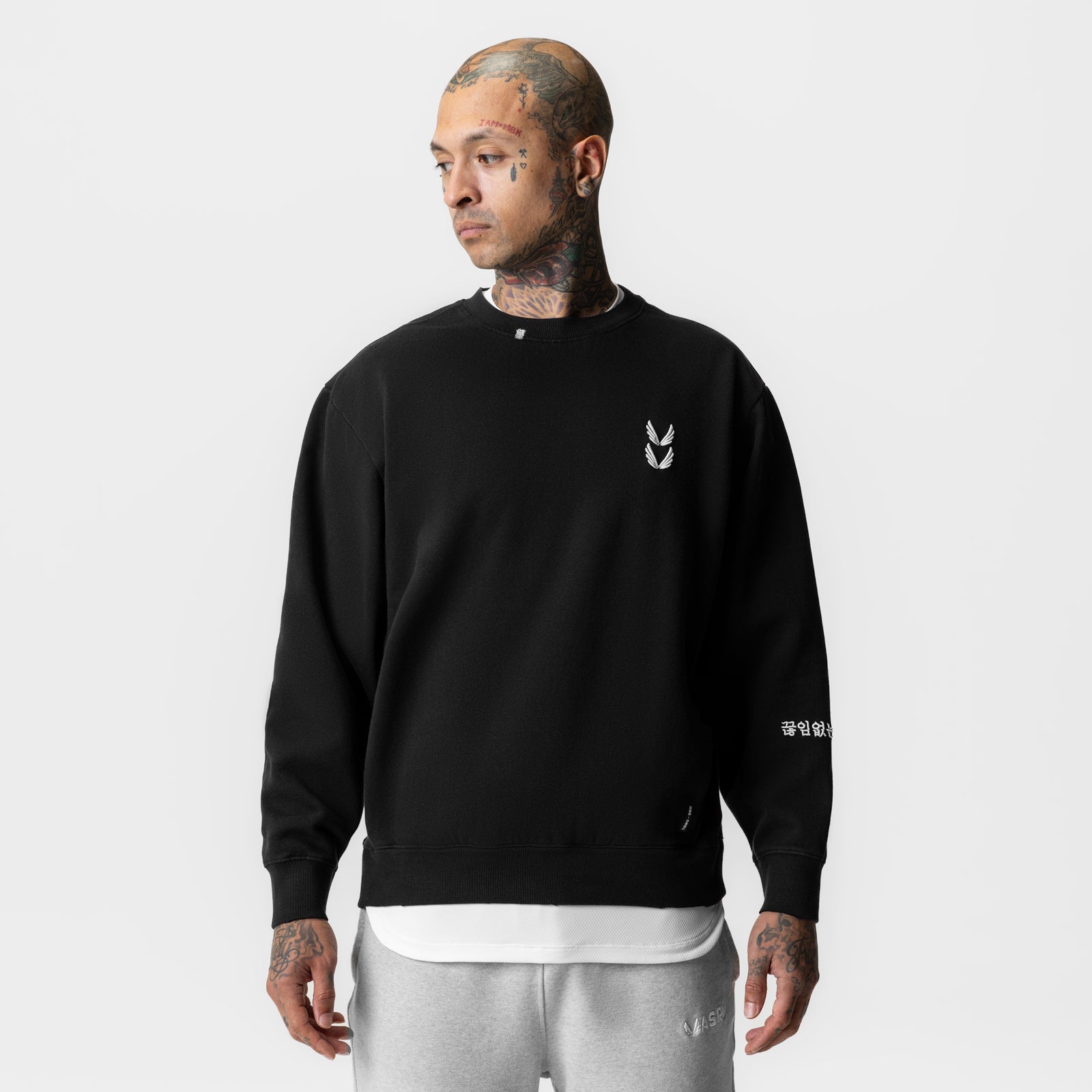 Tech Essential™ Distressed Crewneck in black, worn by model looking to the side