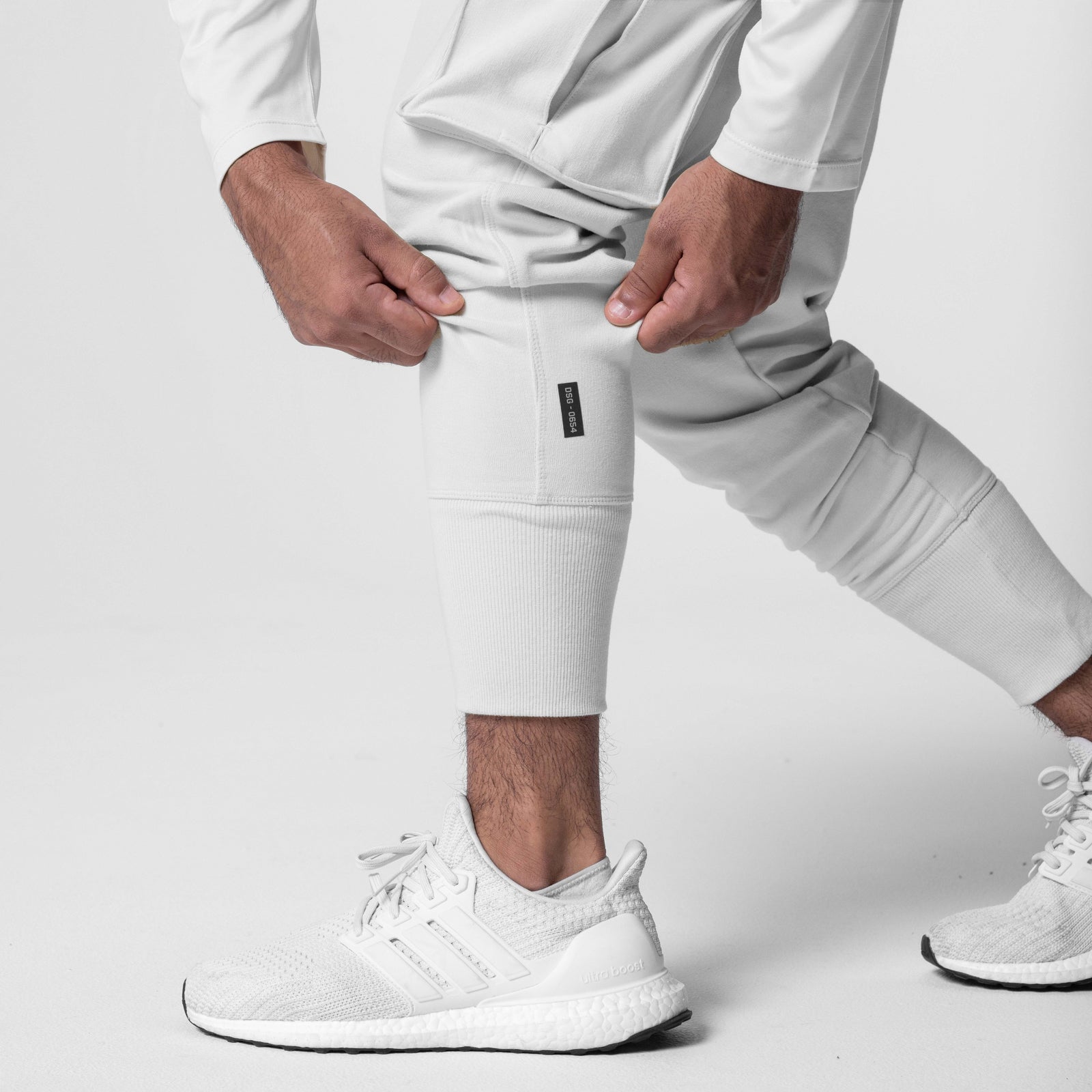Tech-Terry Cargo High Rib Jogger in white, worn by model with white sneakers, front view