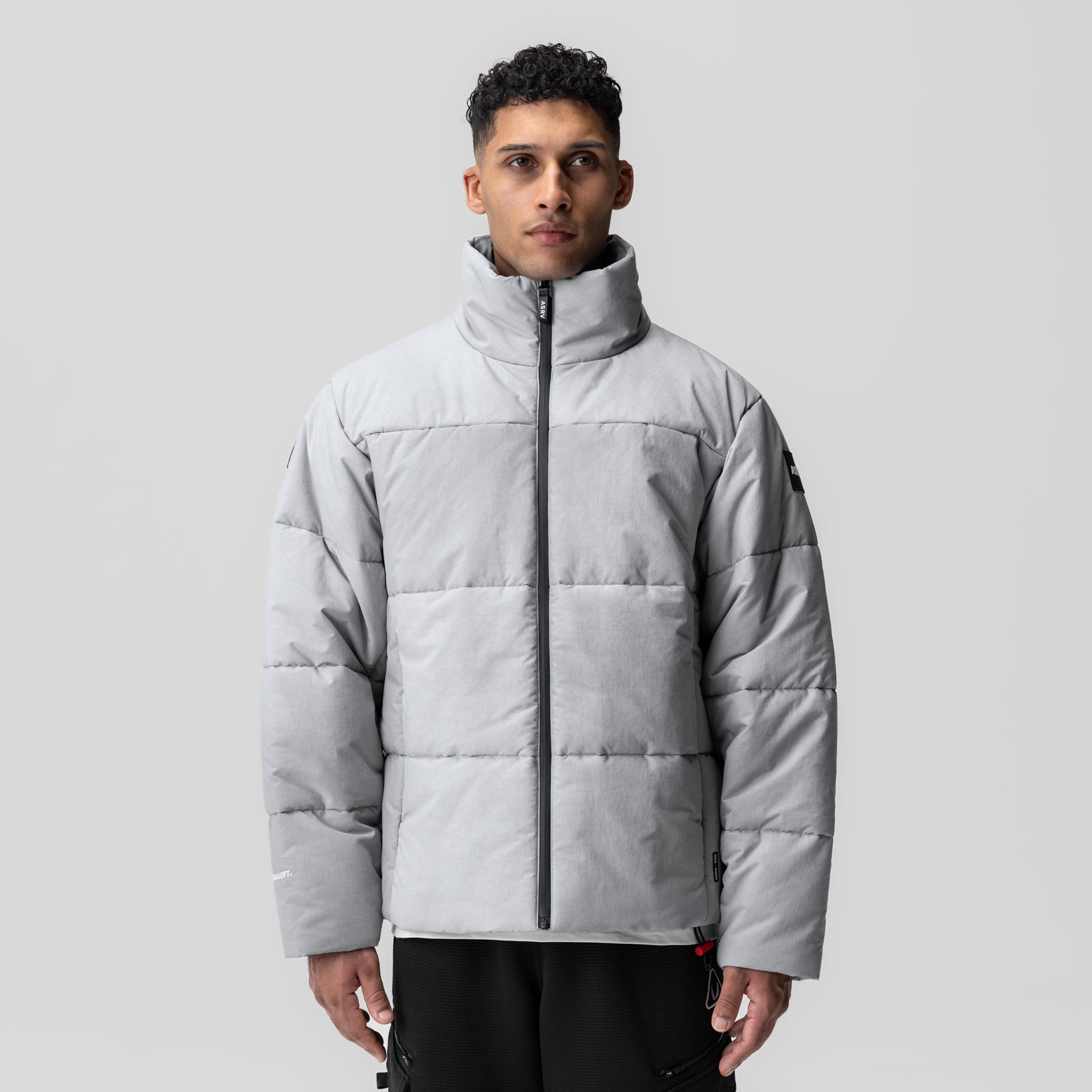 Grey Wave Dye PrimaLoft puffer jacket on model, front view