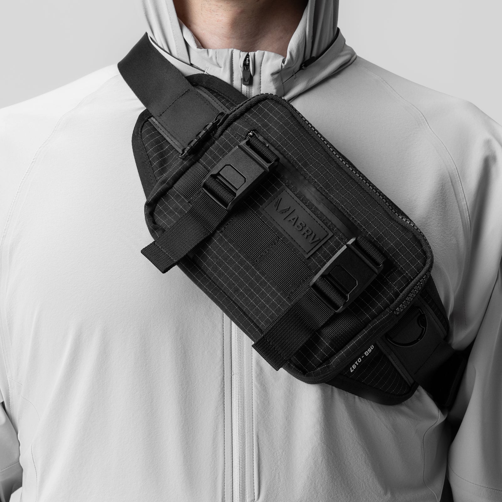 0197. Small Crossbody Bag in black grid, worn across chest