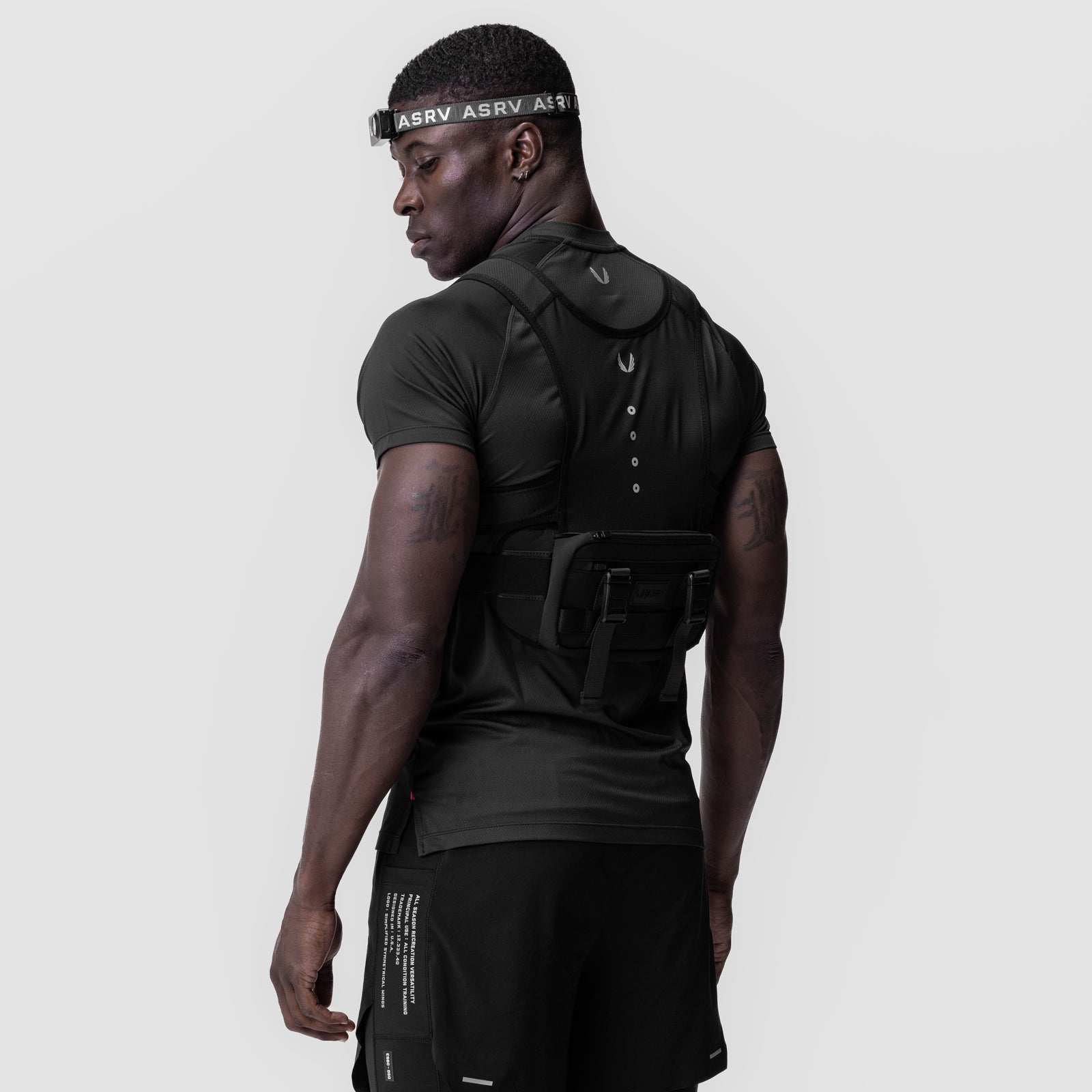 Black monocle headwear worn by model in profile, showcasing ASRV branding and design