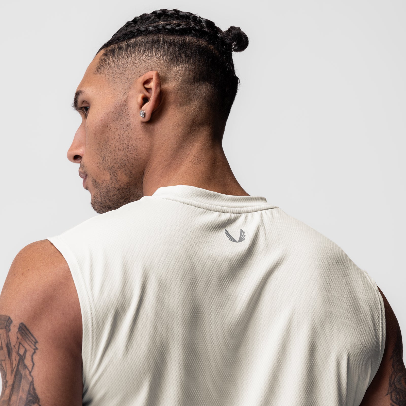 AeroSilver® Cutoff Tank in Ivory Cream, worn by model, side profile view