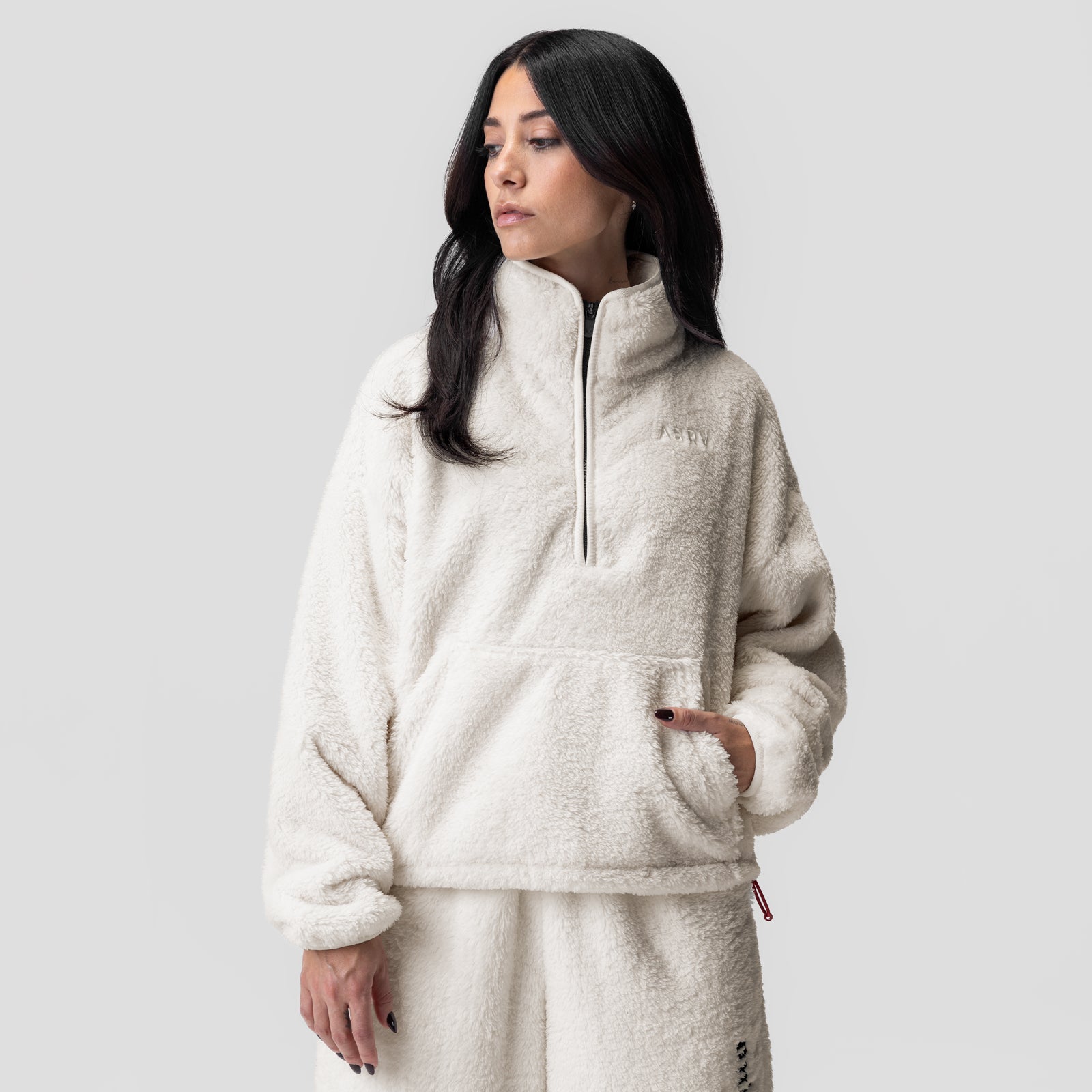 Women's Sherpa Recovery 1/2 Zip in ivory cream, modeled standing with hand in pocket