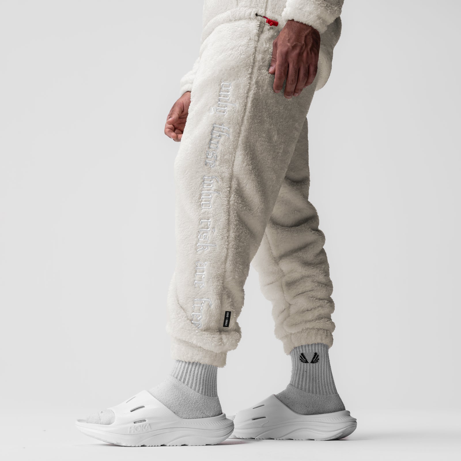 Sherpa Recovery Sweats in Ivory Cream worn by model, side view showing full length silhouette