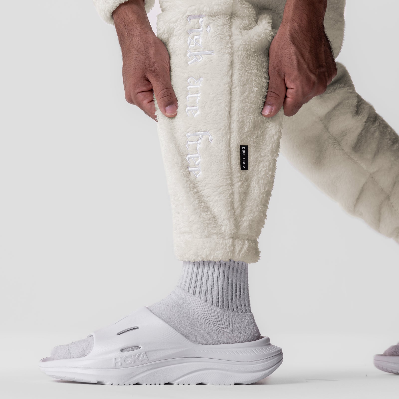 Sherpa Recovery Sweats in Ivory Cream worn by model, detail view of leg and foot