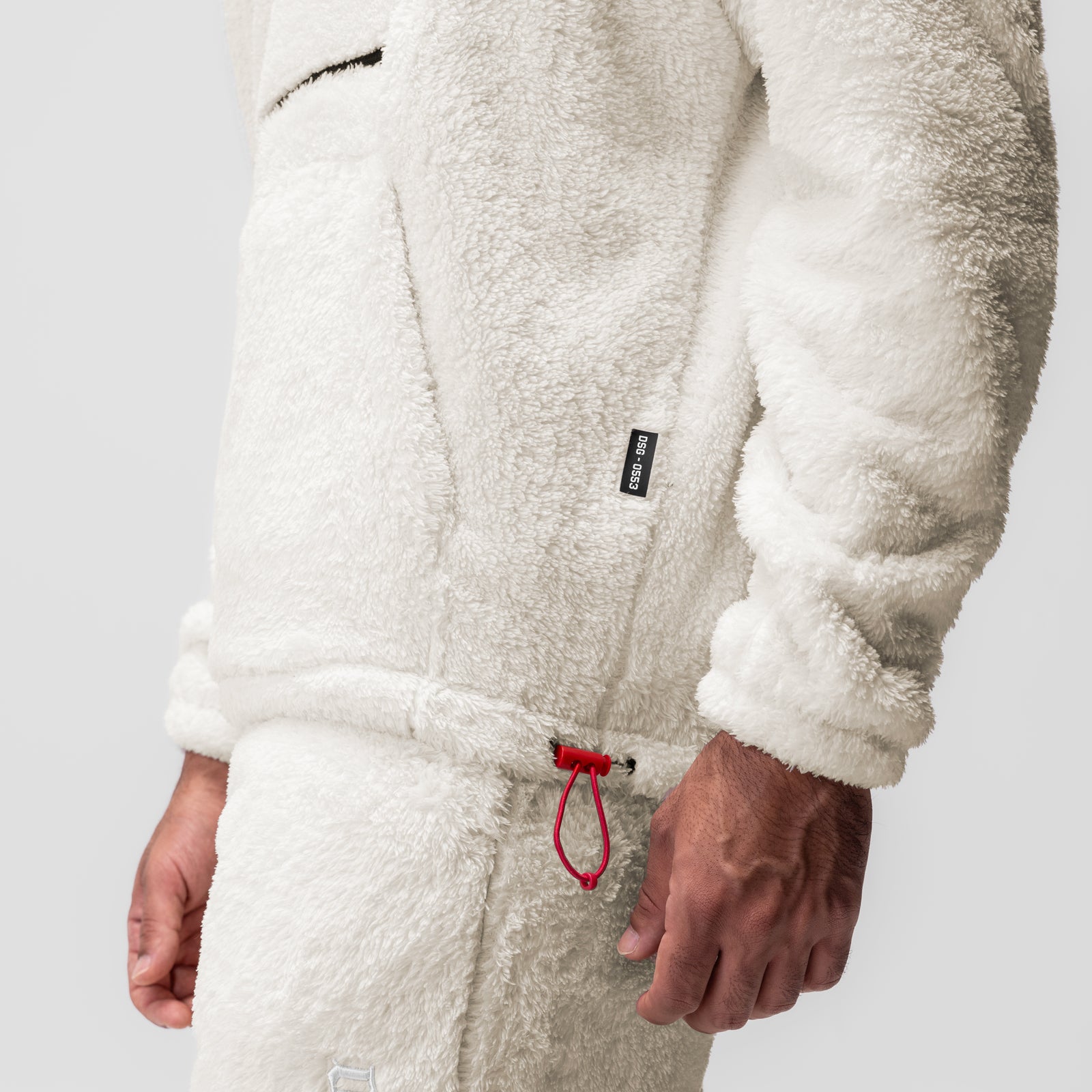 Sherpa Recovery Hoodie in Ivory Cream worn by model, close-up of torso and drawstring detail