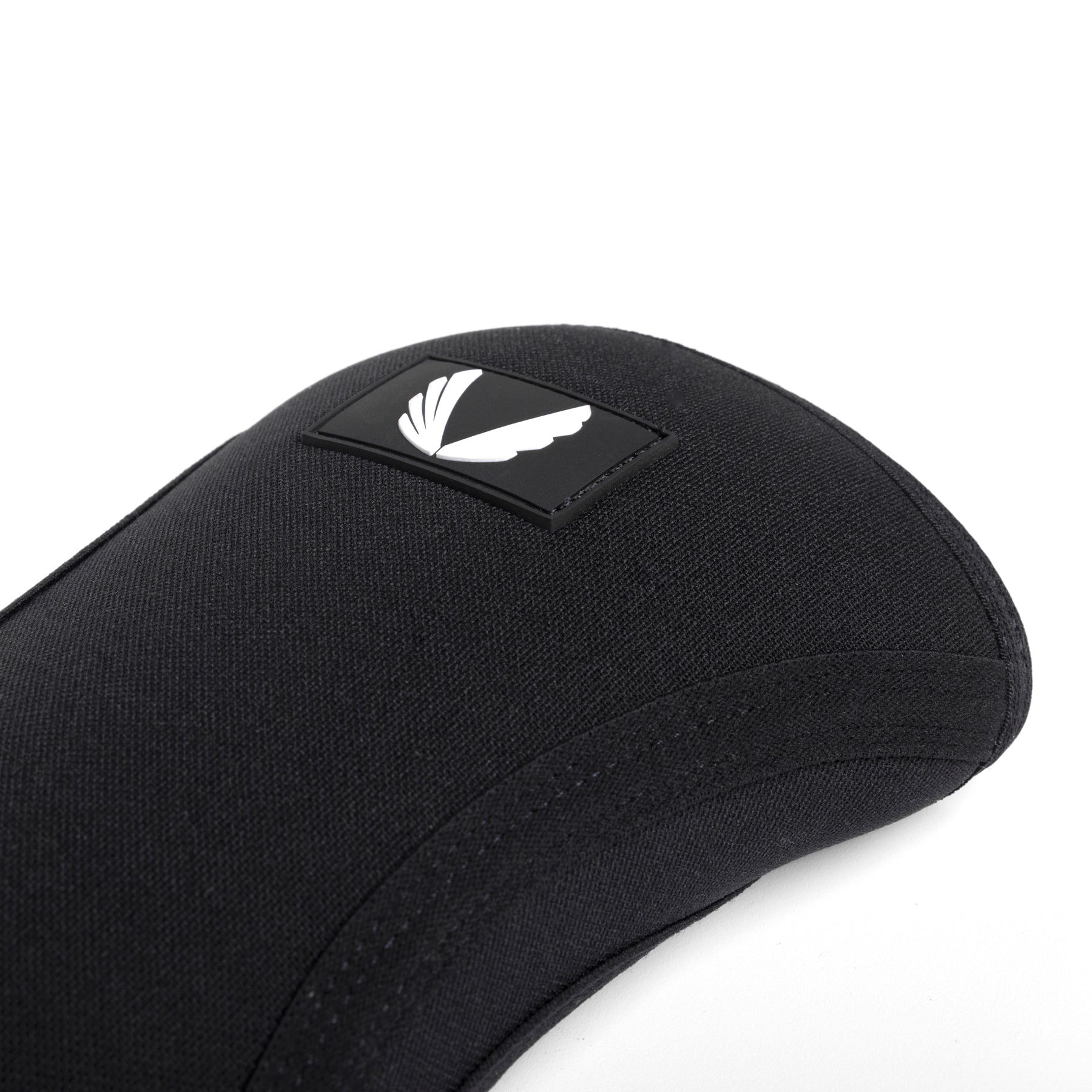 Black knee sleeves detail closeup showing fabric texture and logo patch