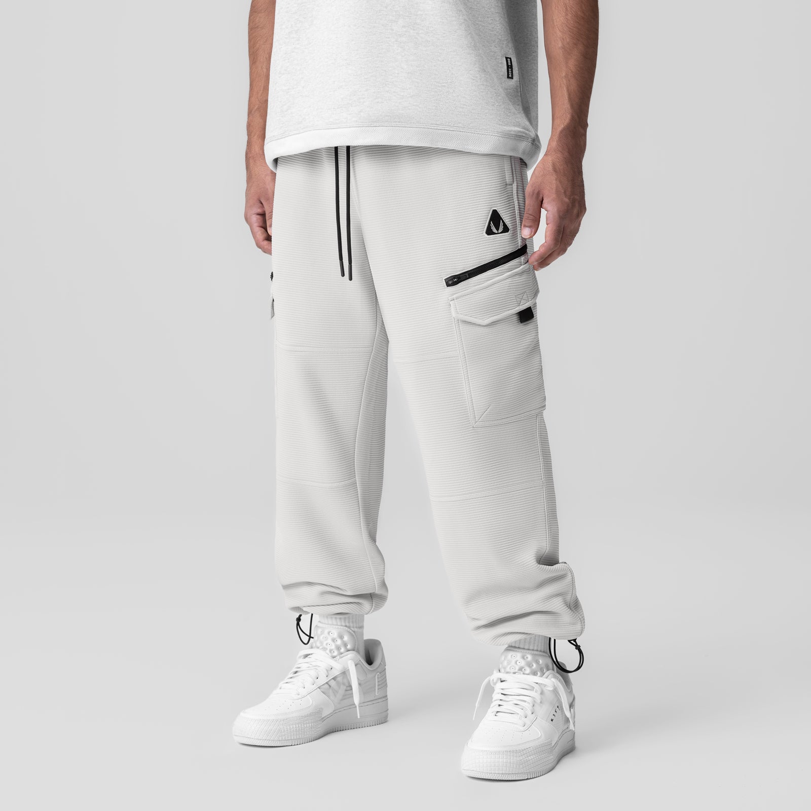 Deltapeak® Cargo Cinch Jogger in light grey, worn by model with white sneakers, front view