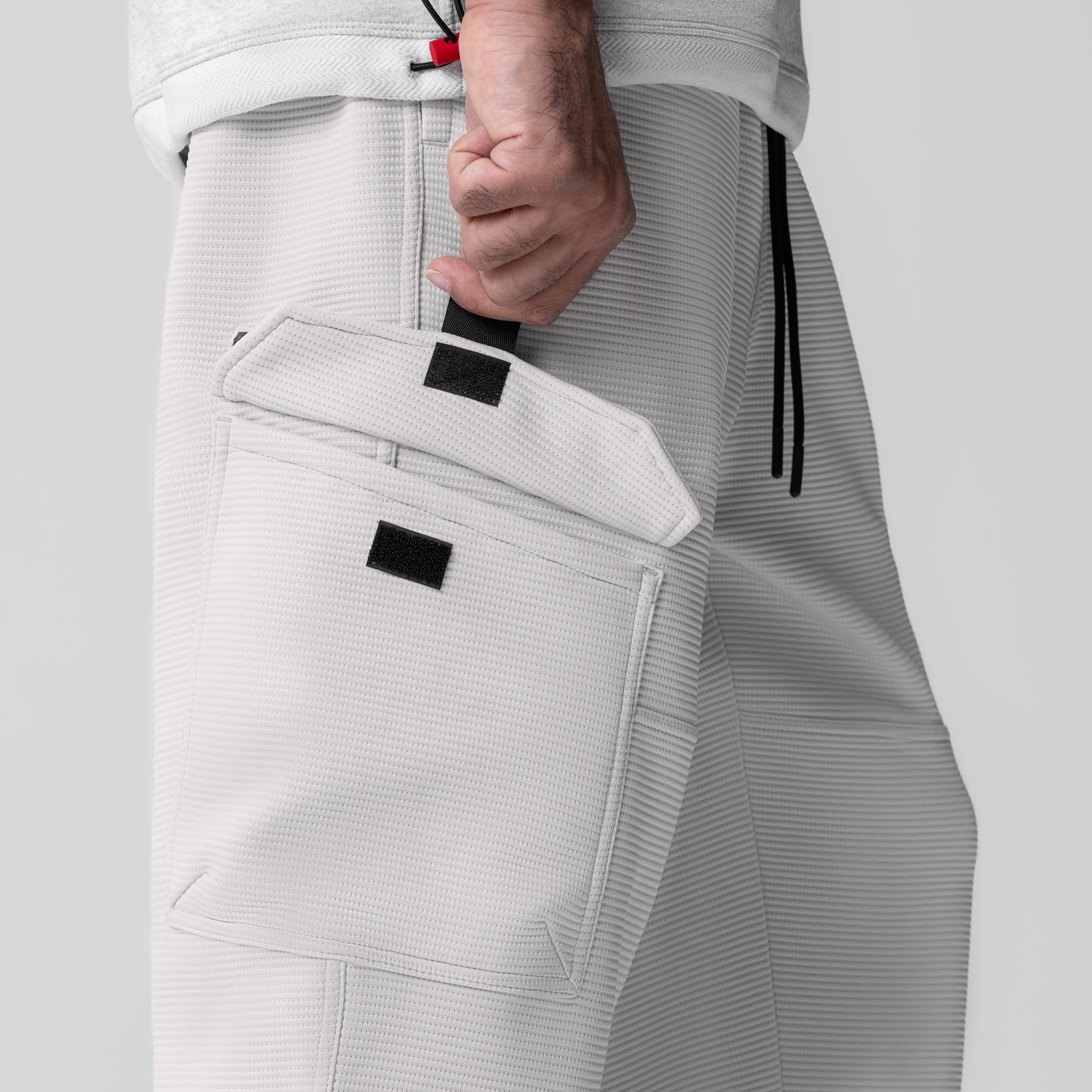 Deltapeak® Cargo Cinch Jogger in light grey, modeled with hand in pocket detail