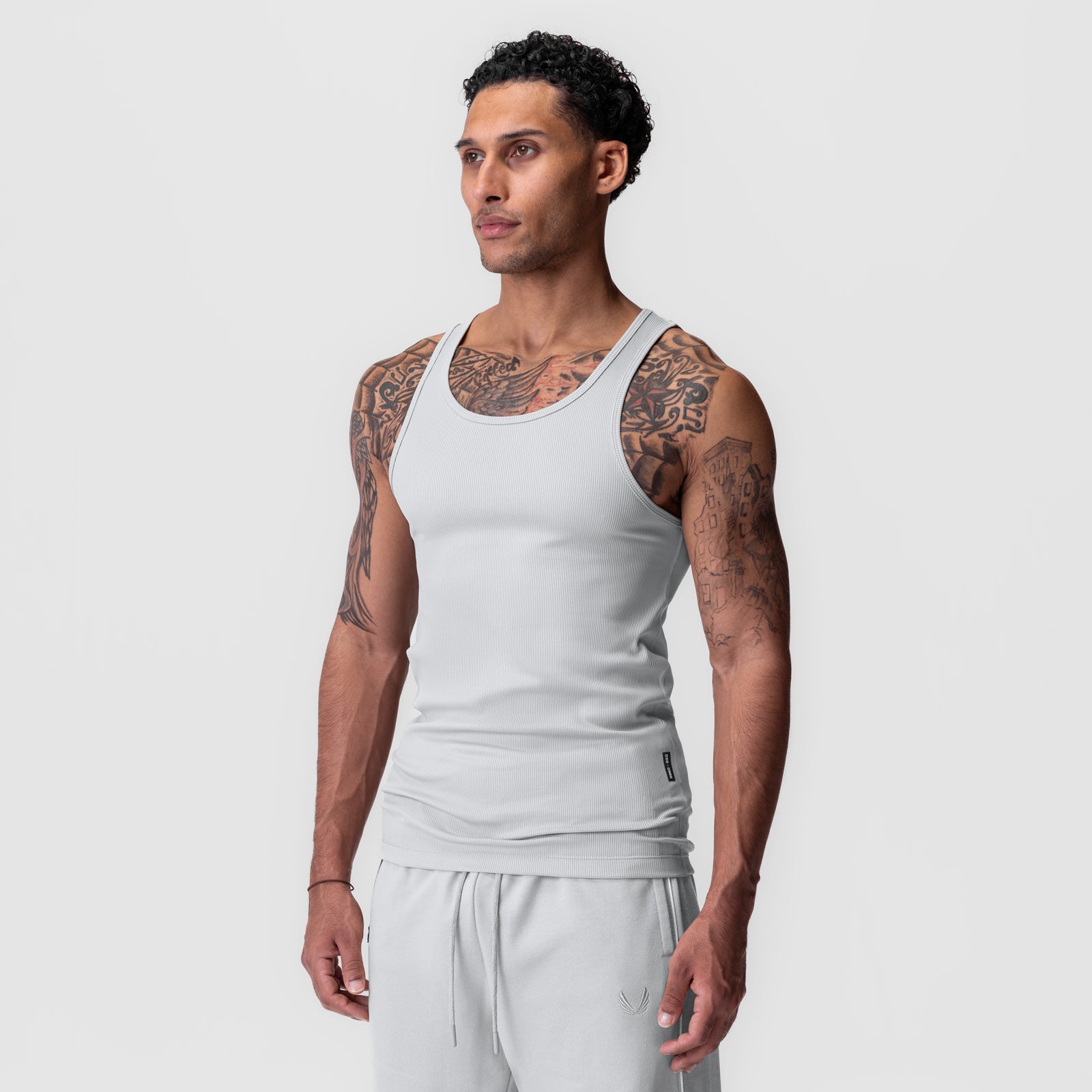 Creora® Tech Ribbed Tank in light grey worn by male model, front view