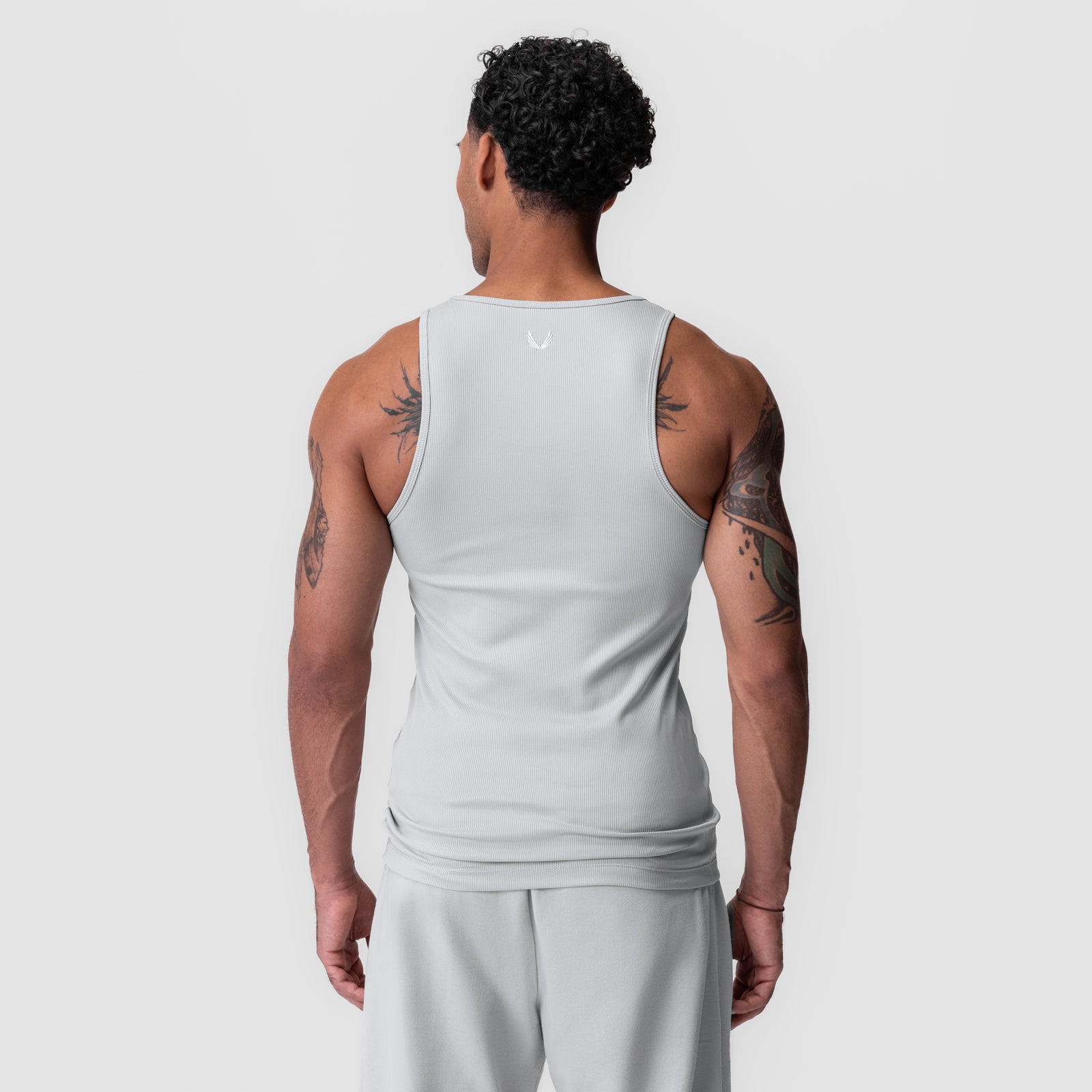 Creora® Tech Ribbed Tank in light grey, back view on model