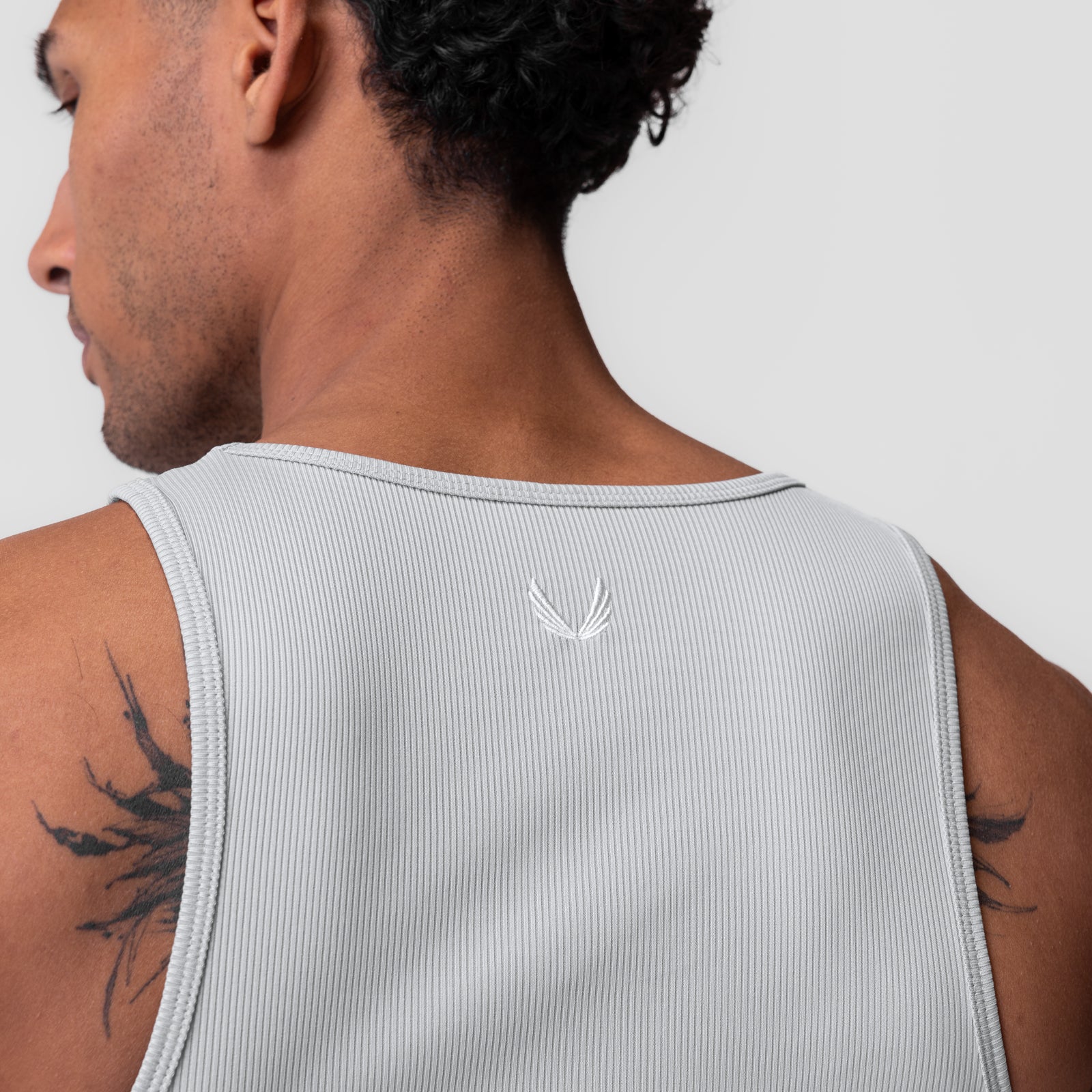 Creora® Tech Ribbed Tank in light grey, back view on model