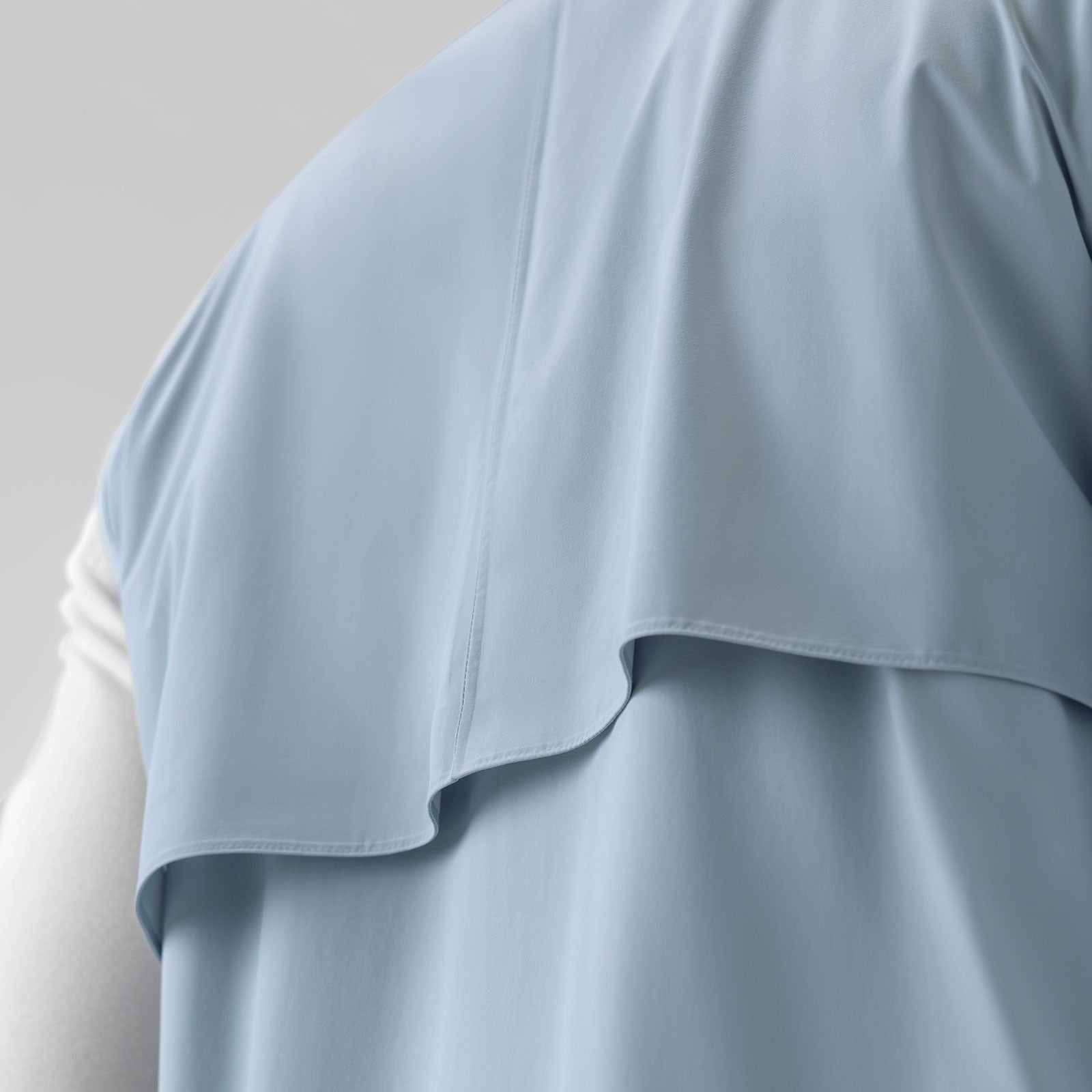 Aerotex PrimaLoft Run Vest in Light Sky, detail shot of ruffle hem on model