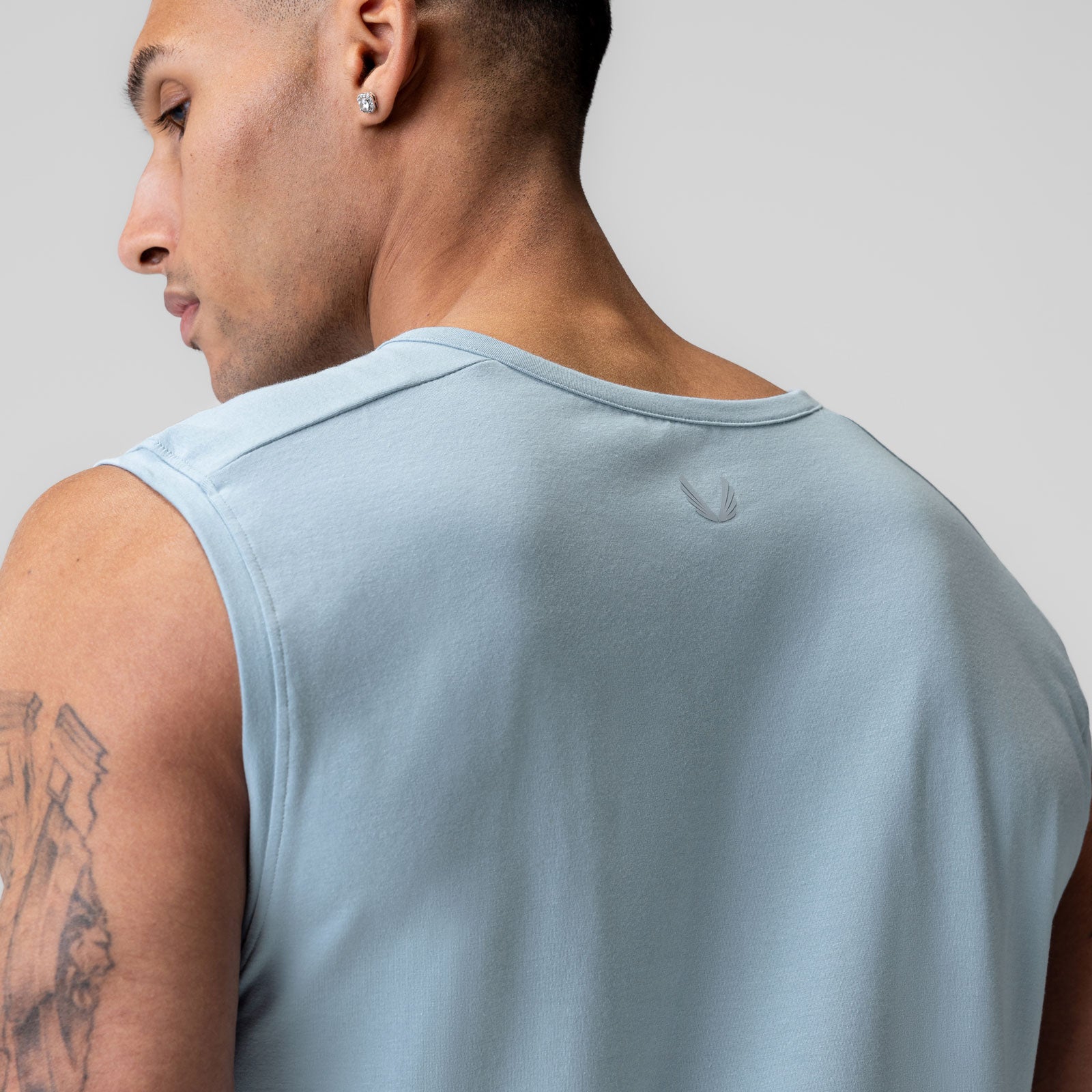 Creora® Cotton Modal Cutoff Tank in Light Sky, worn by model shown from back profile