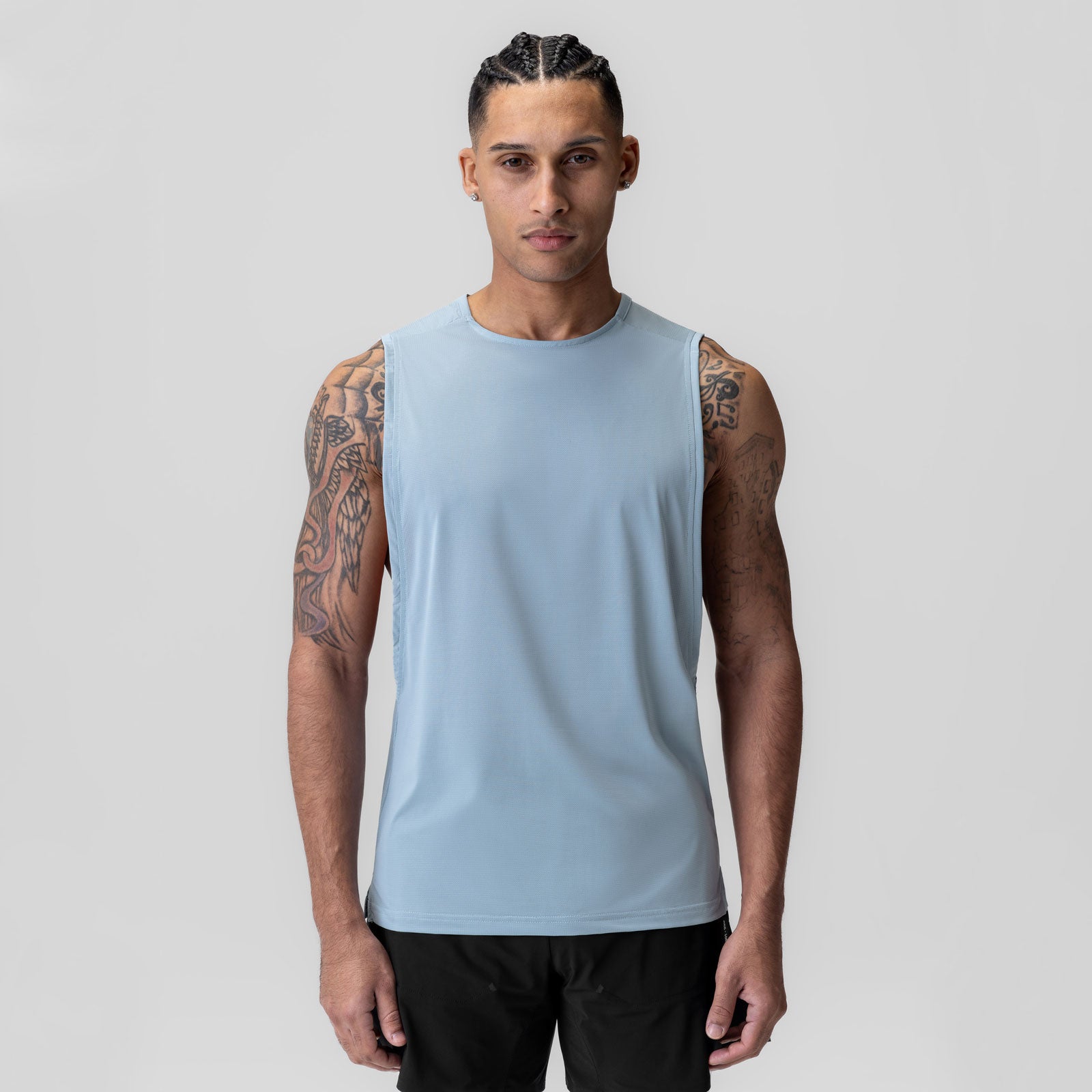 Ice-Skin™ Muscle Tank in light sky, worn by model facing camera