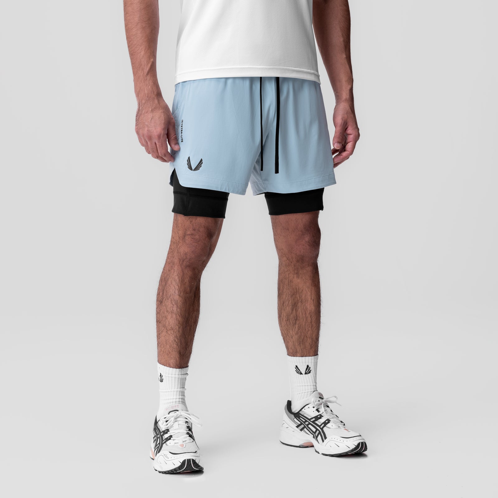 Tetra-Lite 5" Liner Short in Light Sky and Black, worn by model with white tee and sneakers