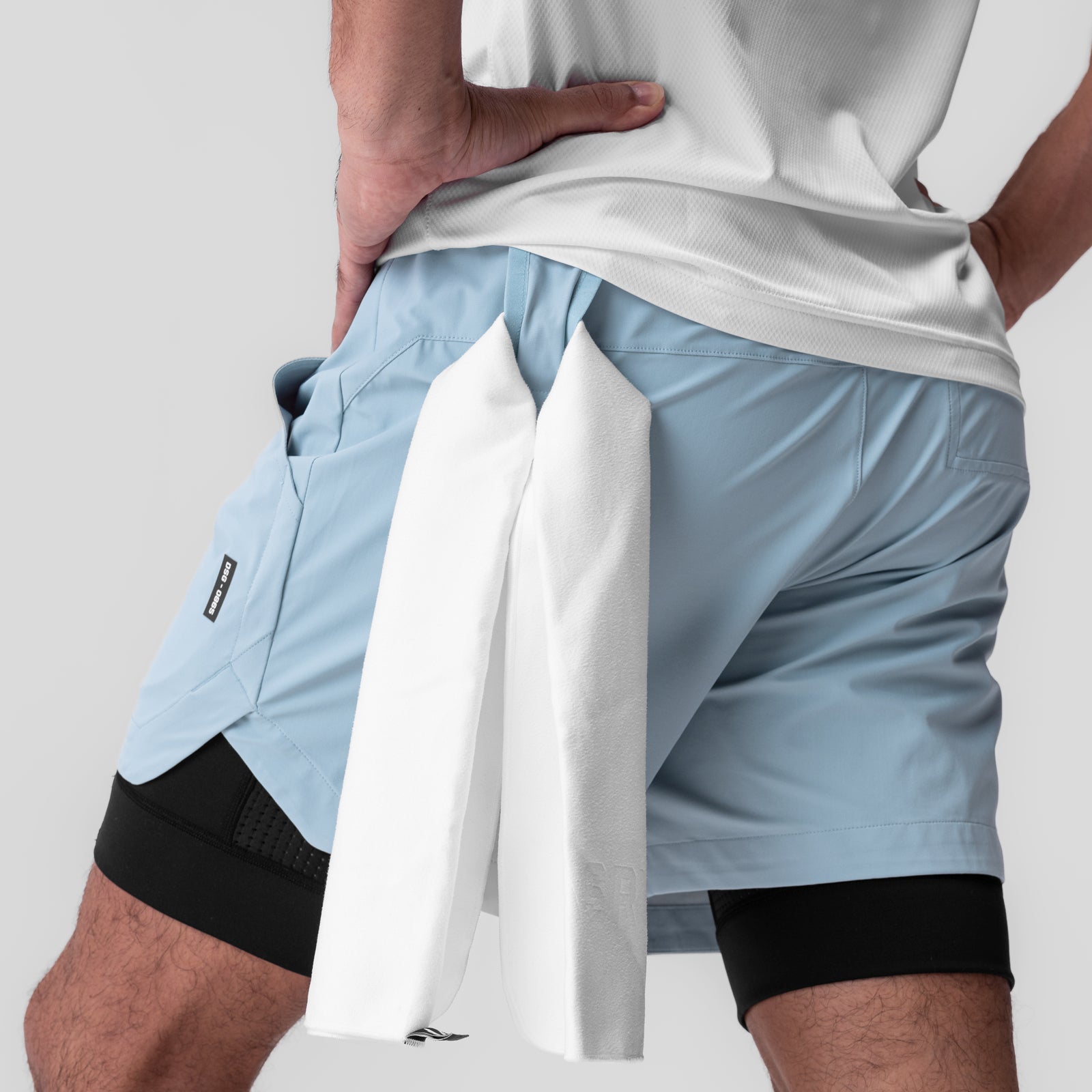 Tetra-Lite® 5" Liner Short in Light Sky and Black, modeled with white towel
