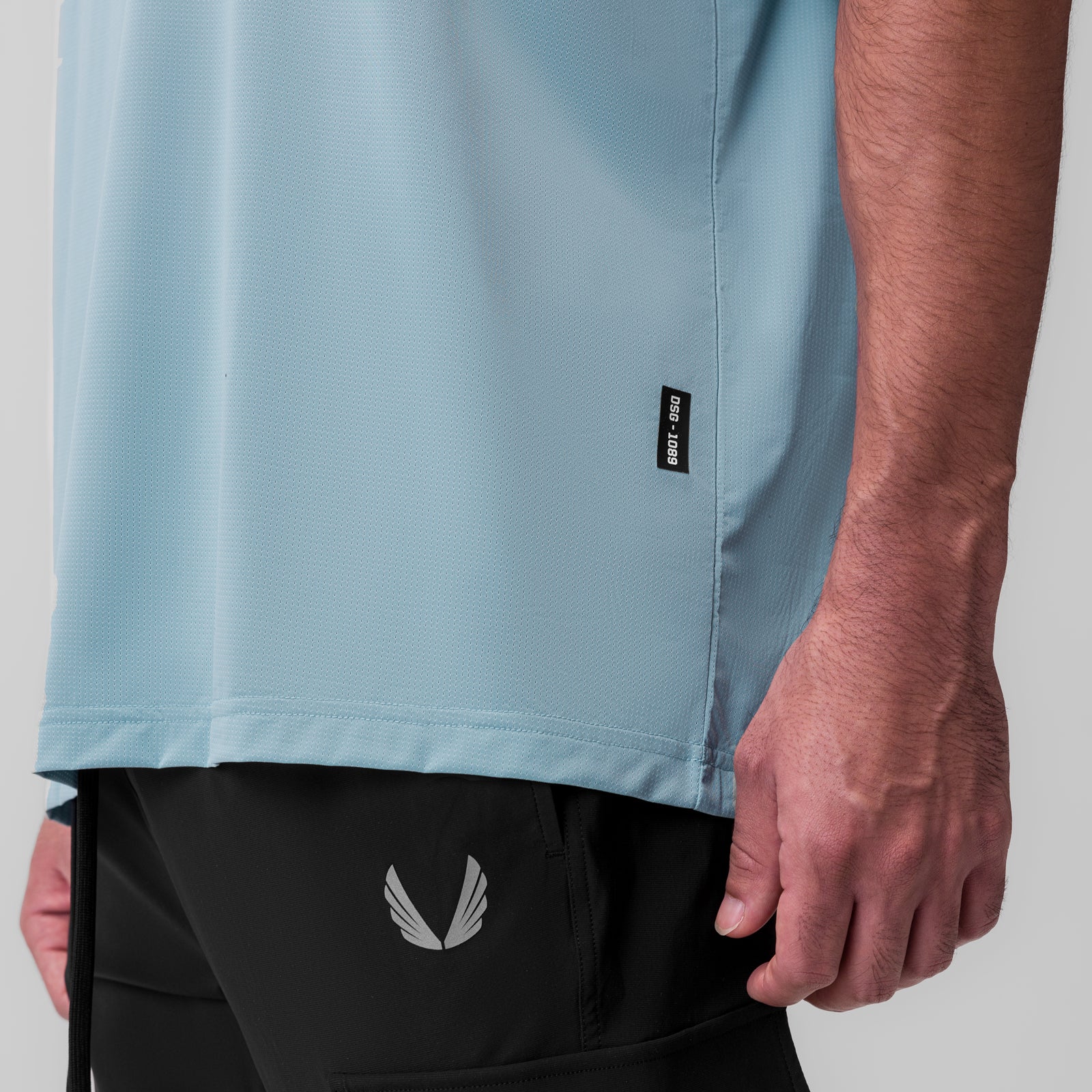 Ice-Skin Oversized Tee in Light Sky worn by model, side view detail