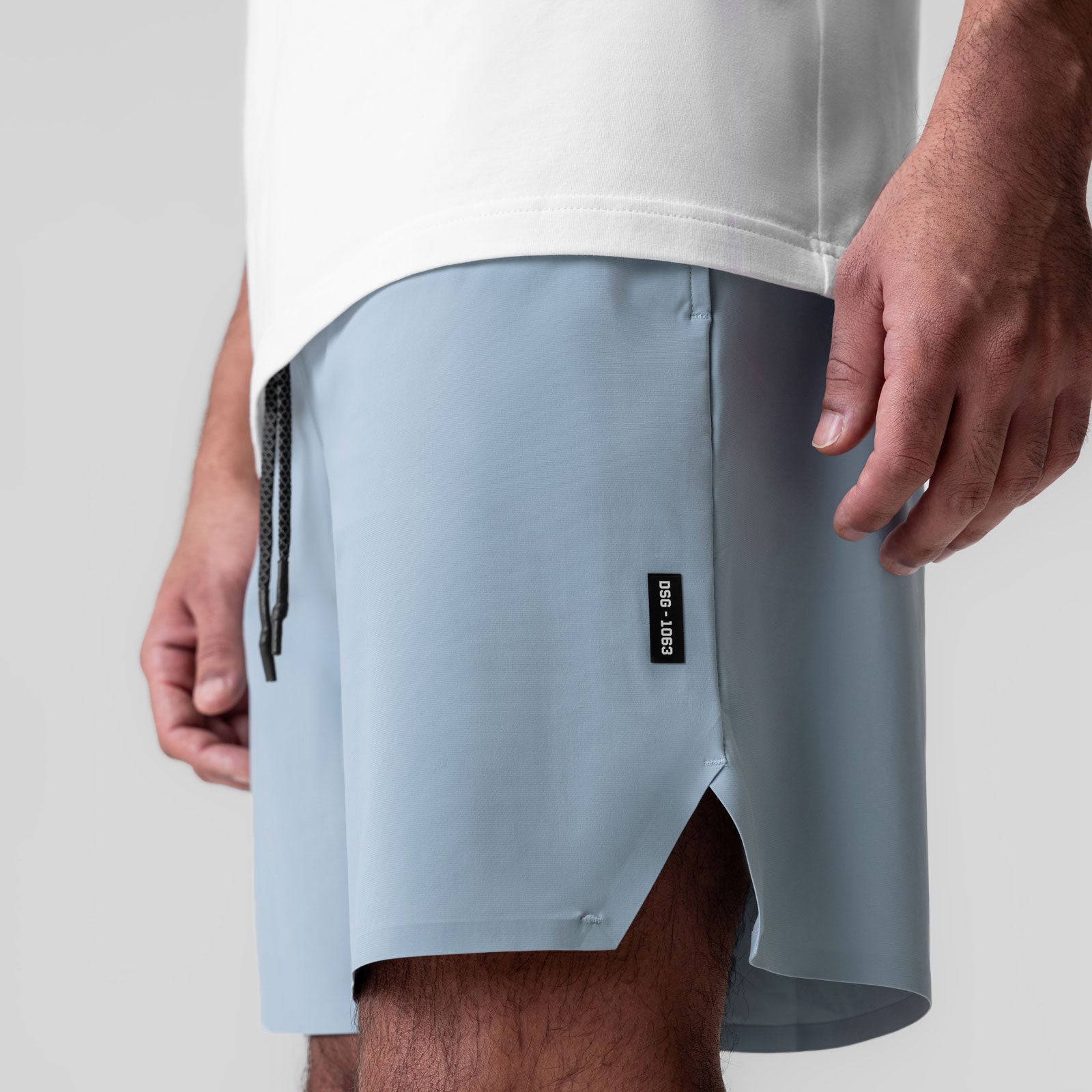 Revolutional® Field Short in Light Sky, worn by model showing side view with drawstring detail