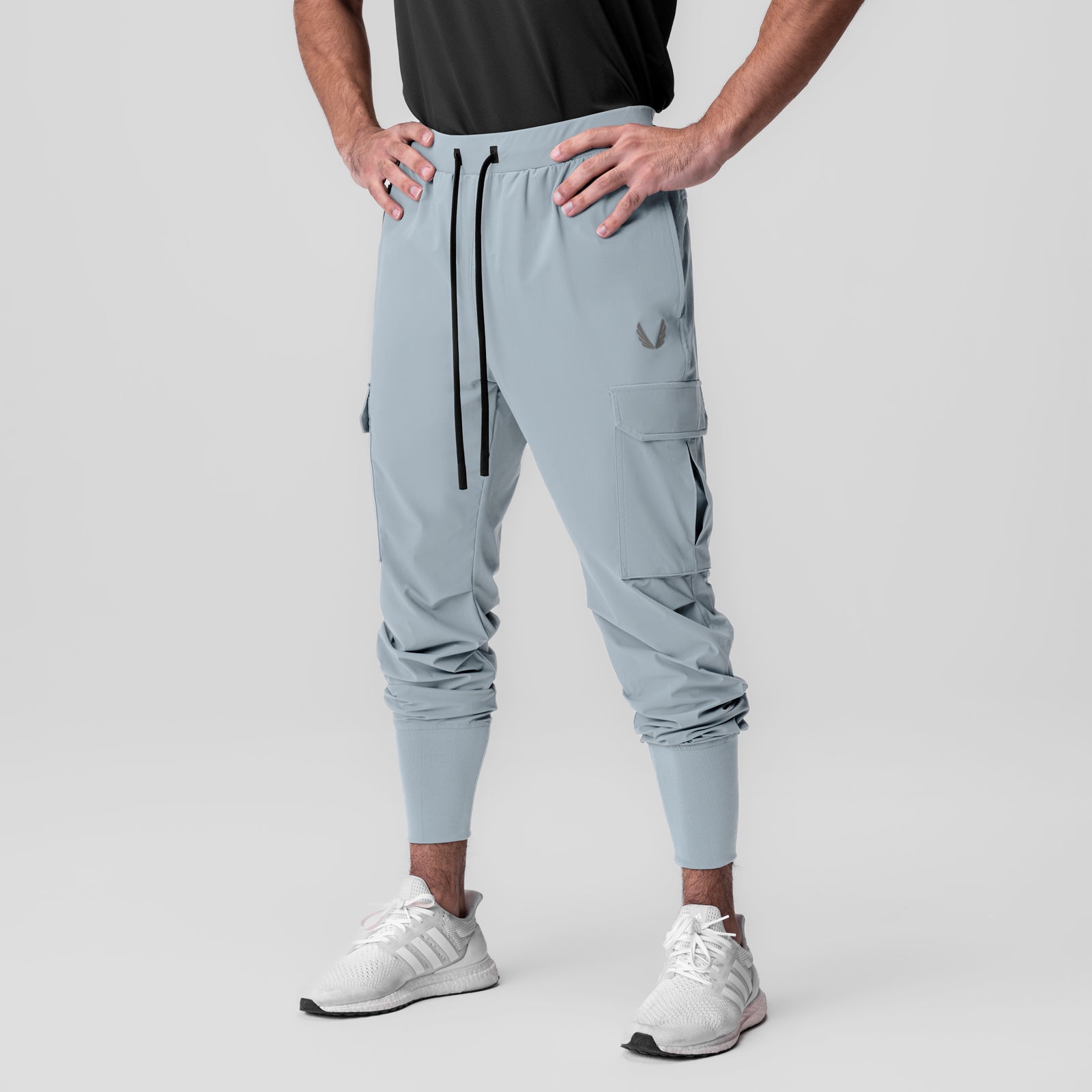 Tetra-Lite Ice Cargo High Rib Jogger in light sky, worn by model standing with hands on hips