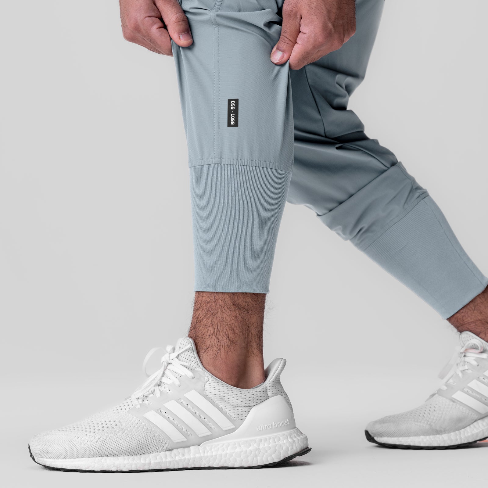 Tetra-Lite Ice Cargo High Rib Jogger in light sky worn with white sneakers, side view