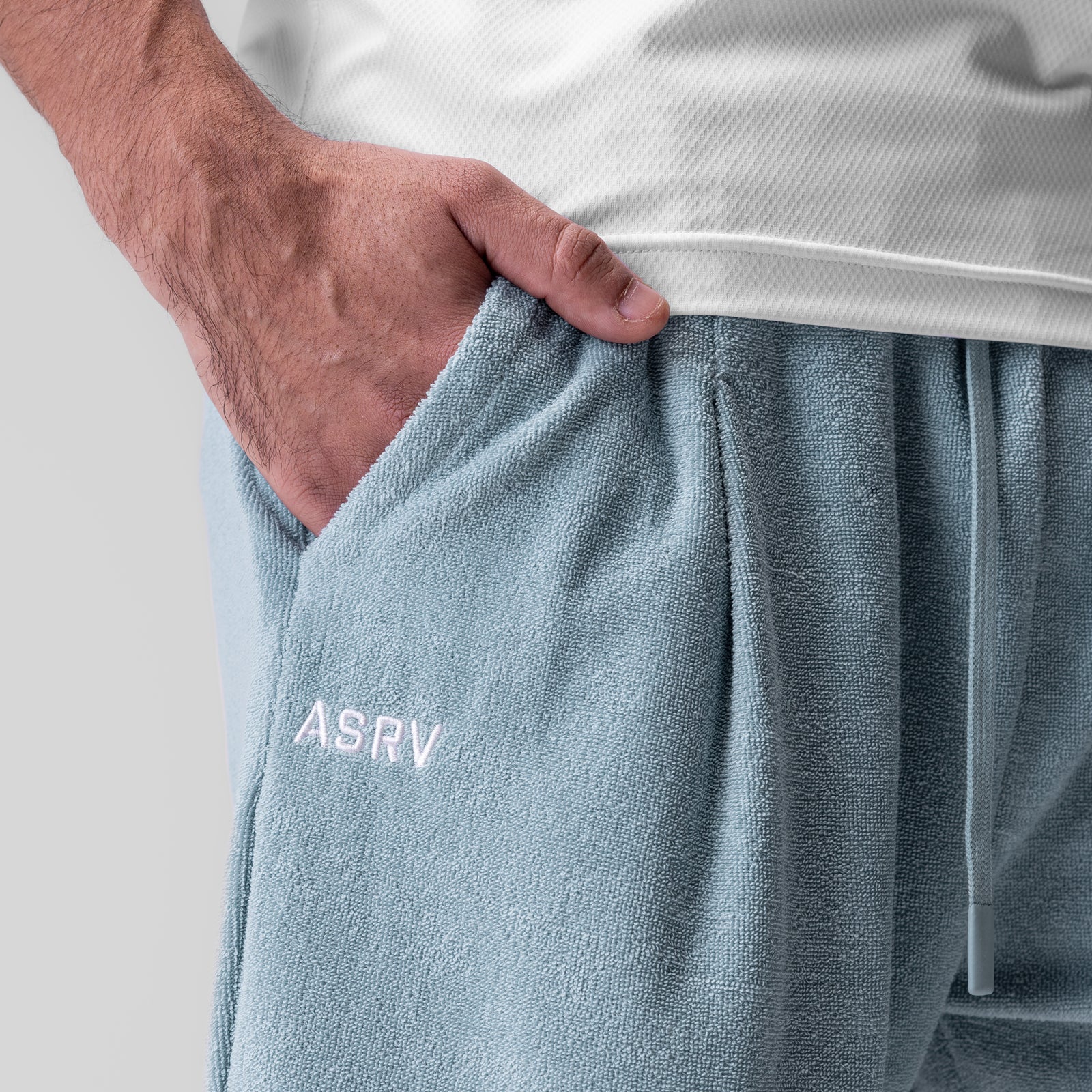 Towel Terry Relaxed Short in Light Sky, model wearing with hand in pocket