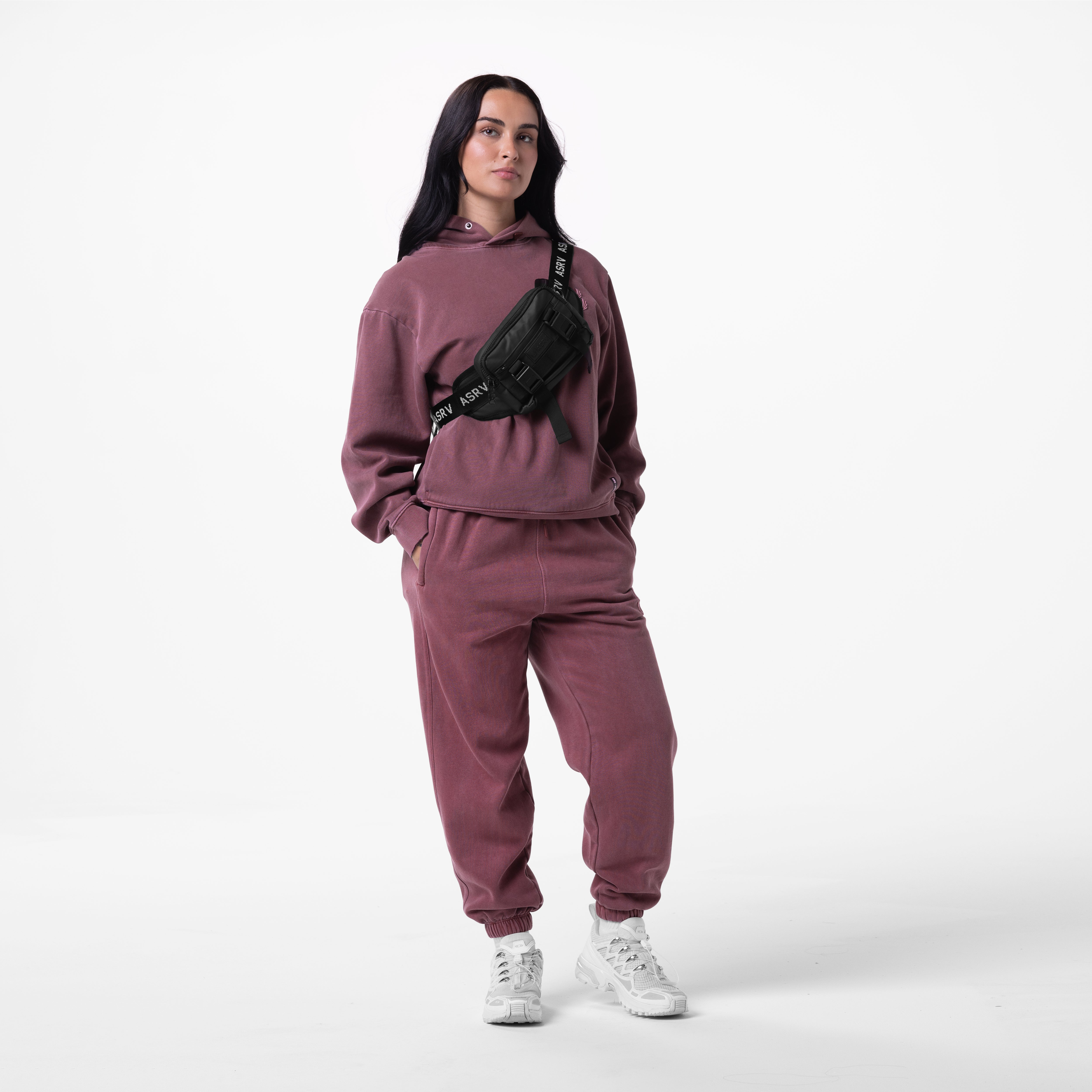 Tech Essential Distressed Hoodie in faded crimson, worn with matching joggers and black waist bag