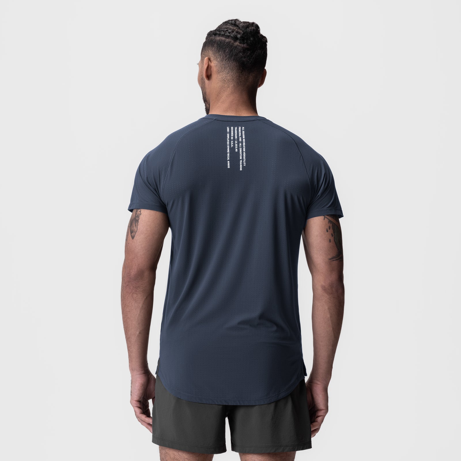 Navy Laser-Vent Established Tee worn by model, back view showing text detail