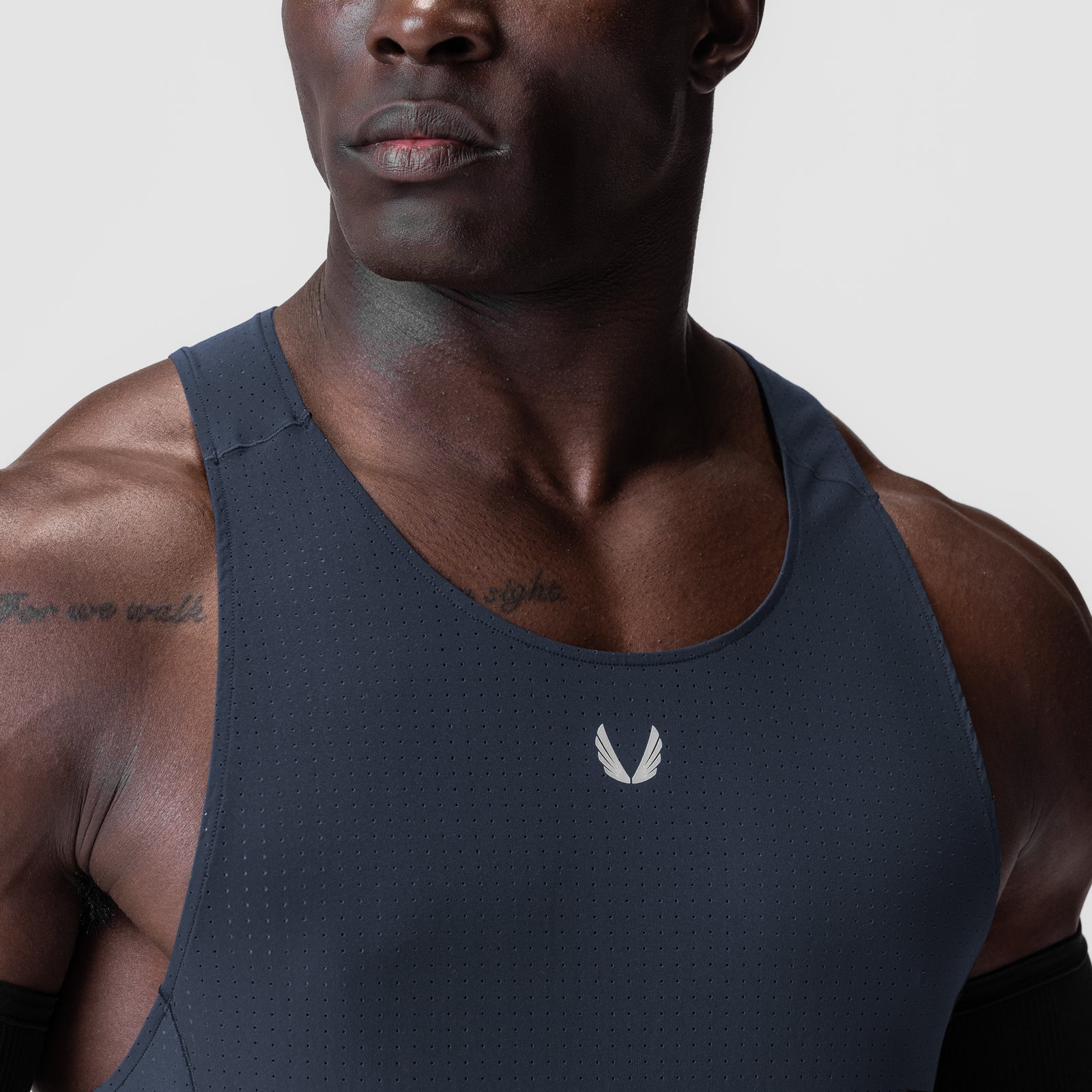 Laser-Vent Singlet Tank in navy worn by model, front view