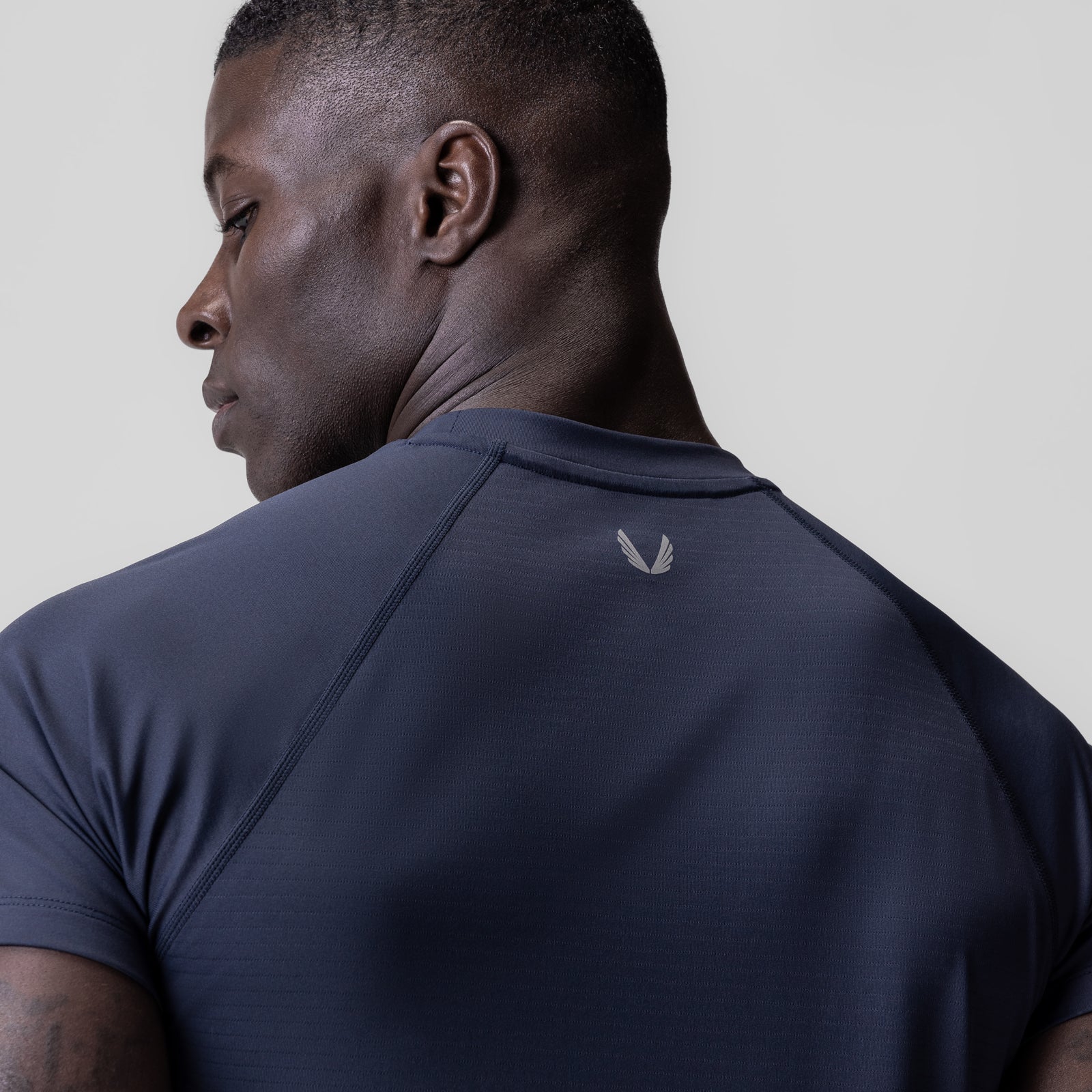 3D-Lite® 2.0 Lycra® Fitted Tee in navy, worn by model shown from back