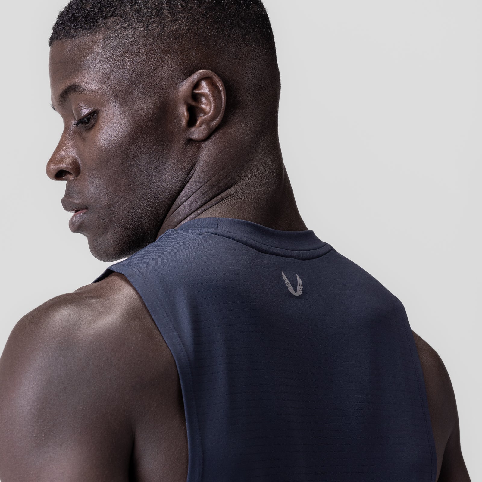Navy 3D-Lite® 2.0 Lycra® muscle tank worn by model, back view