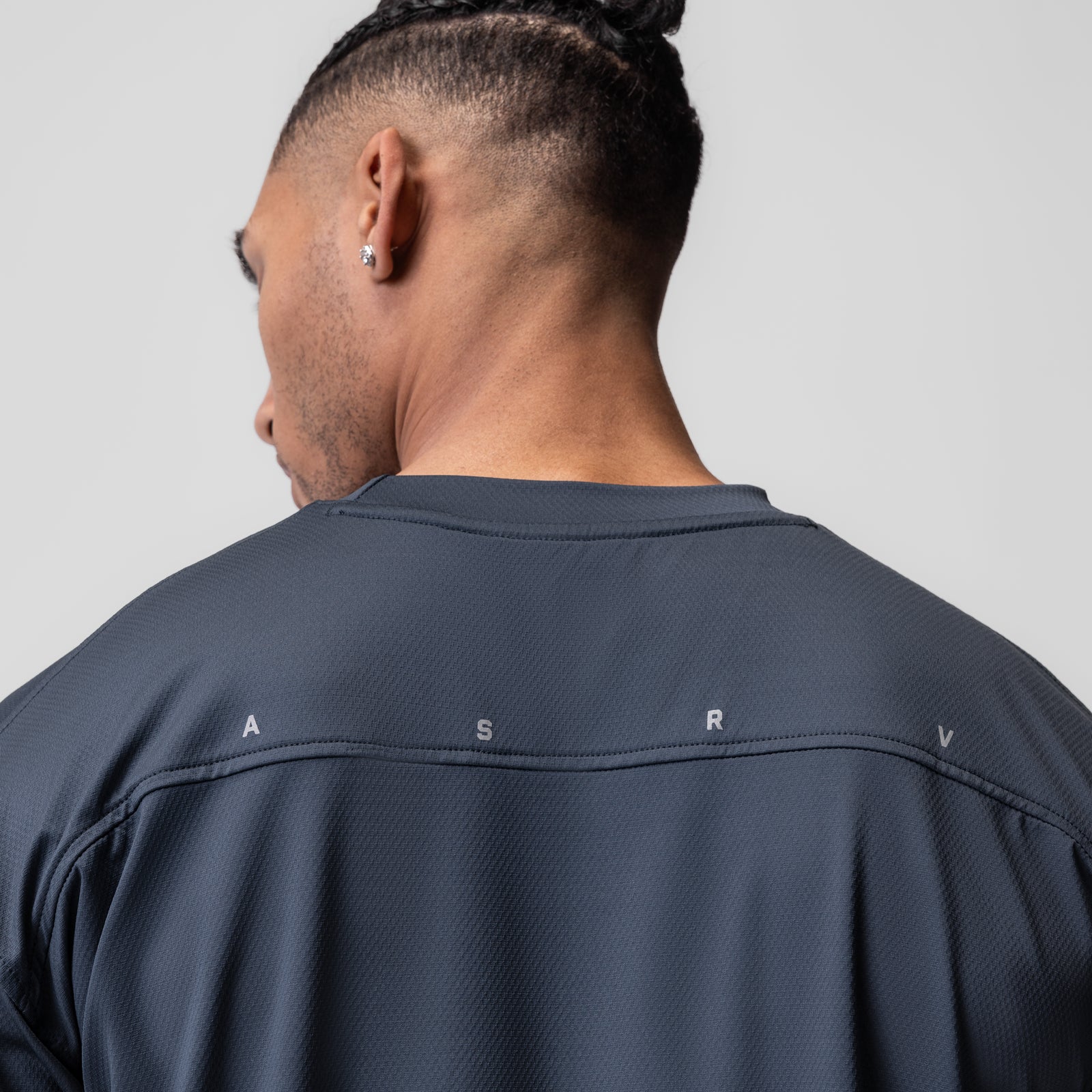 AeroSilver Oversized Tee in navy, back view on model with top knot hairstyle
