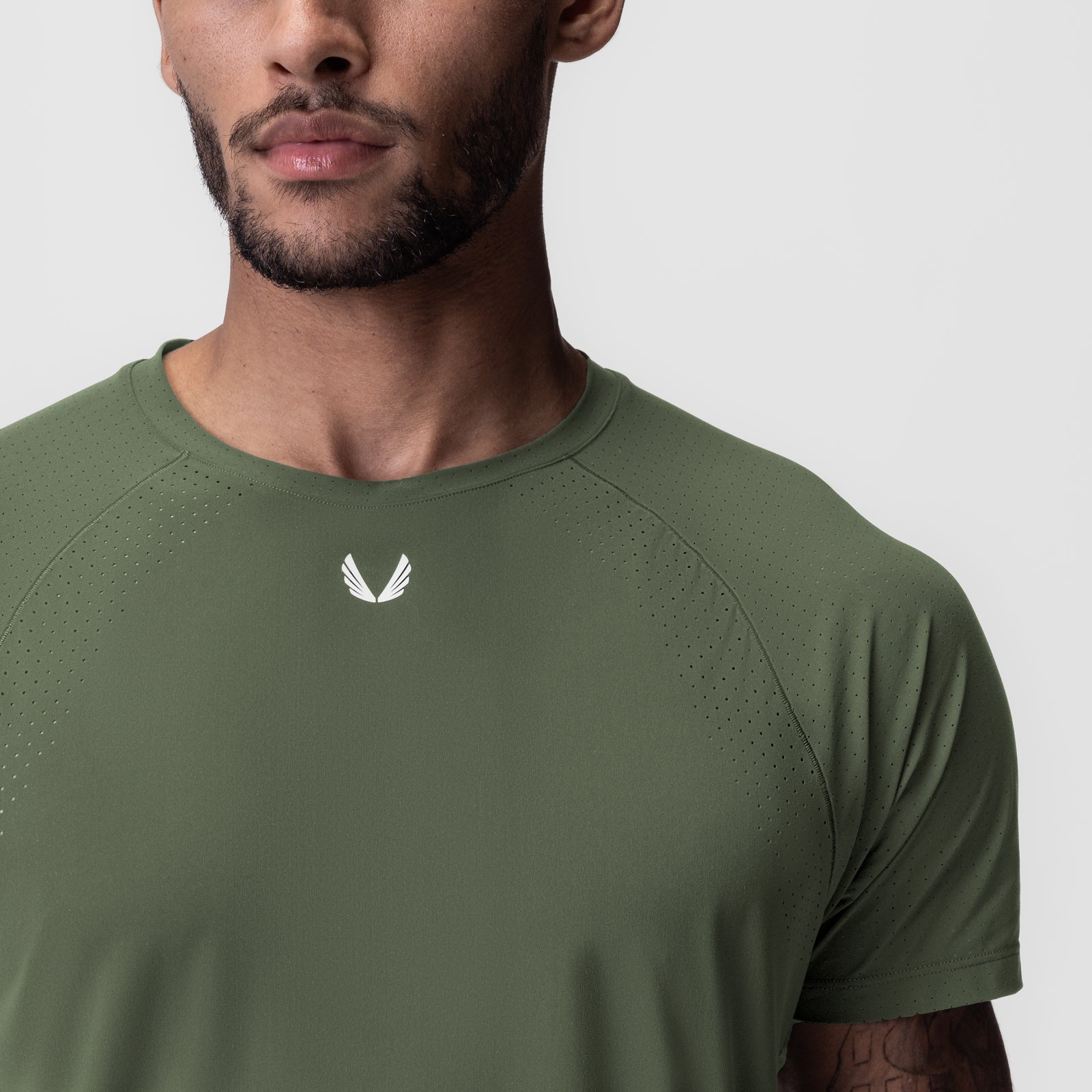 Laser-Vent Established Tee in olive worn by model, front view