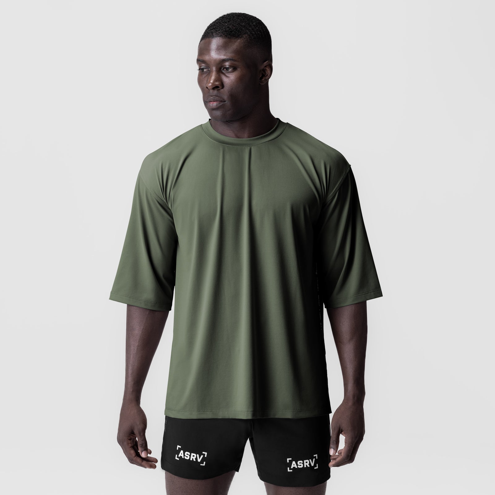 3D-Lite® 2.0 Lycra® oversized tee in olive with 3/4 sleeves, worn with black shorts