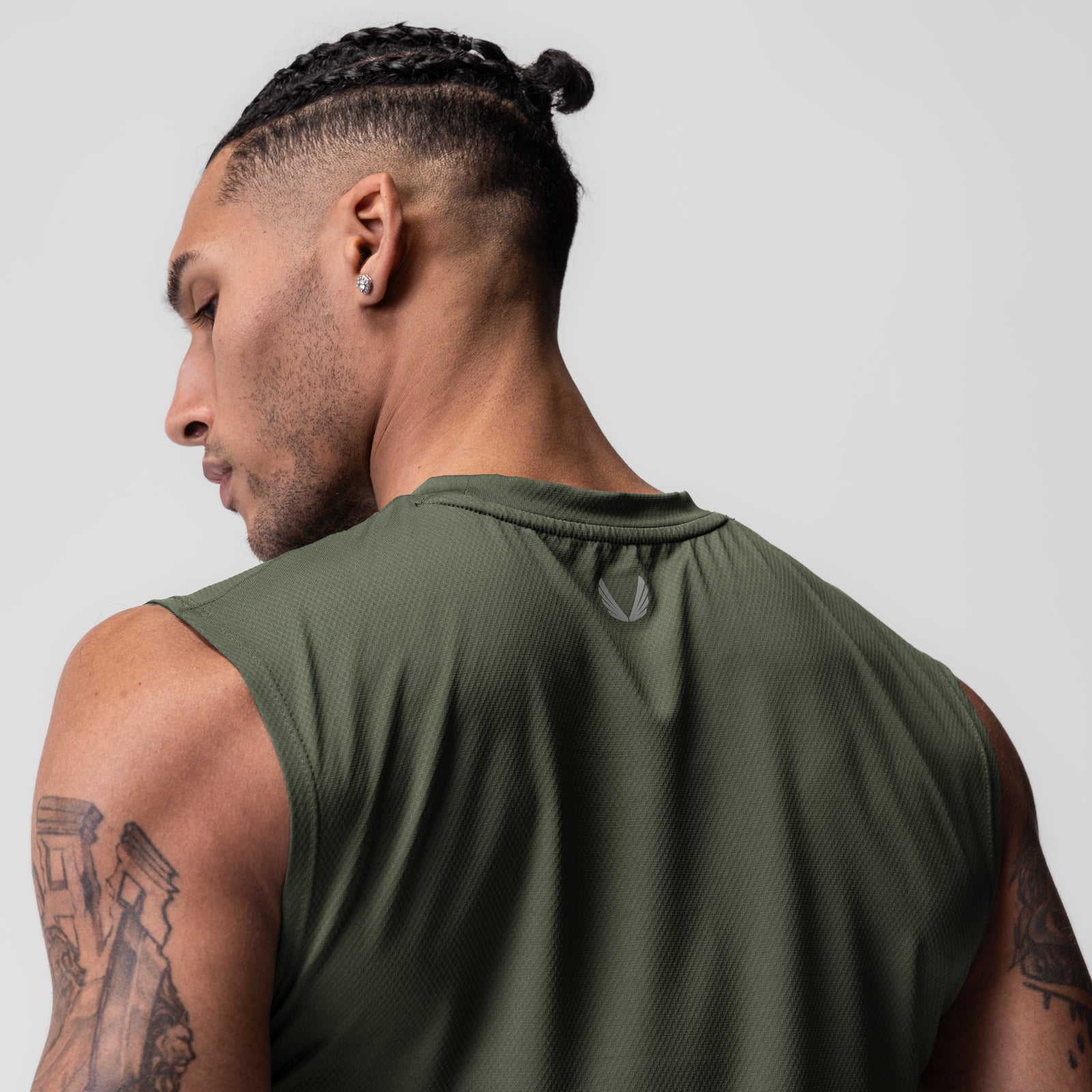 AeroSilver Cutoff Tank in olive, worn by male model shown from back, side profile